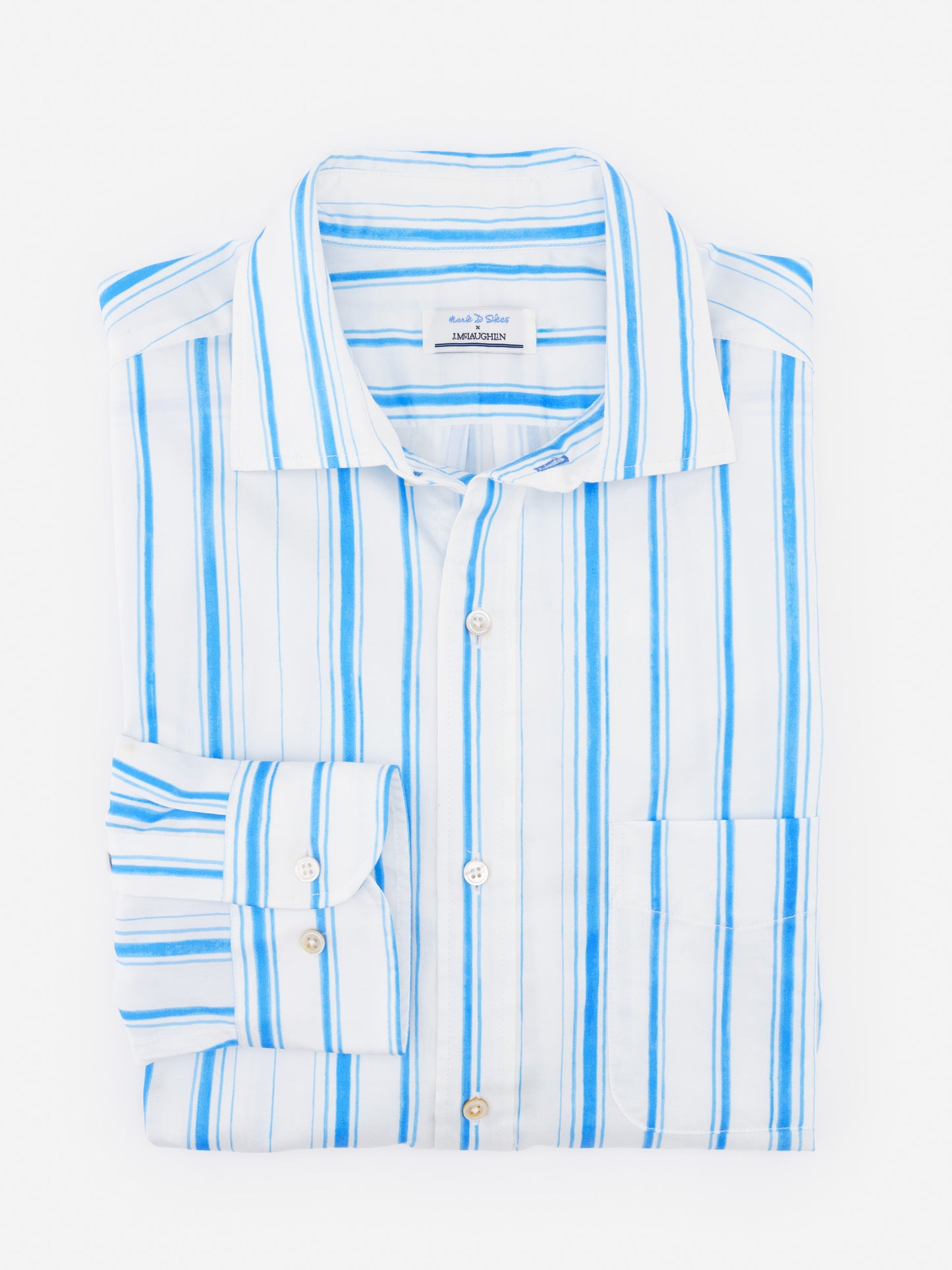 Folded Gramercy Cotton Shirt in Coastal Waterline by J.McLaughlin featuring light blue and white stripes, showcasing effortlessly stylish, enduring designs with innovative fabrics.
