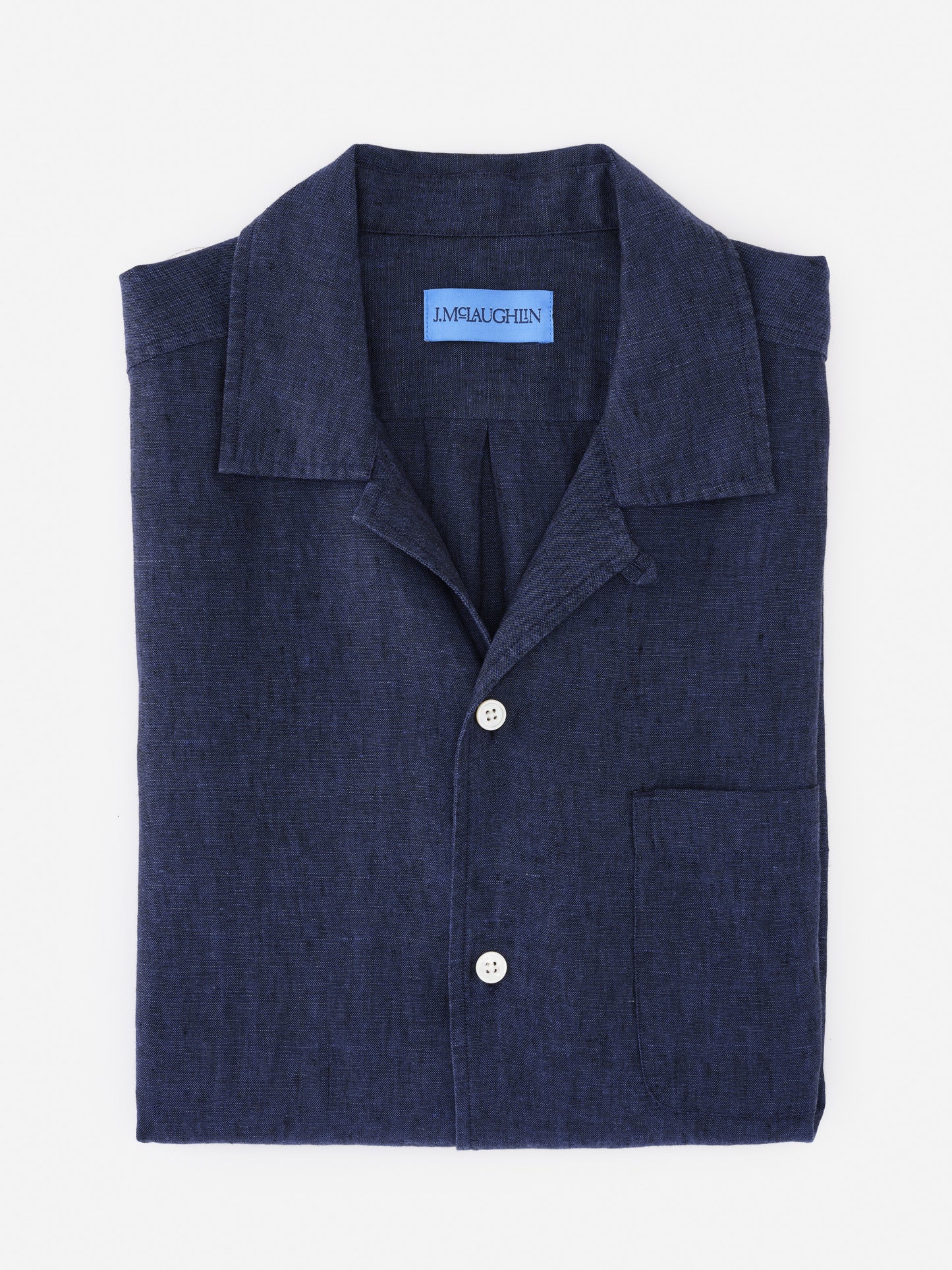 Folded navy blue Montauk Linen Shirt by J.McLaughlin showcasing classic craftsmanship with enduring design and innovative fabrics, effortlessly stylish for a life well-lived.