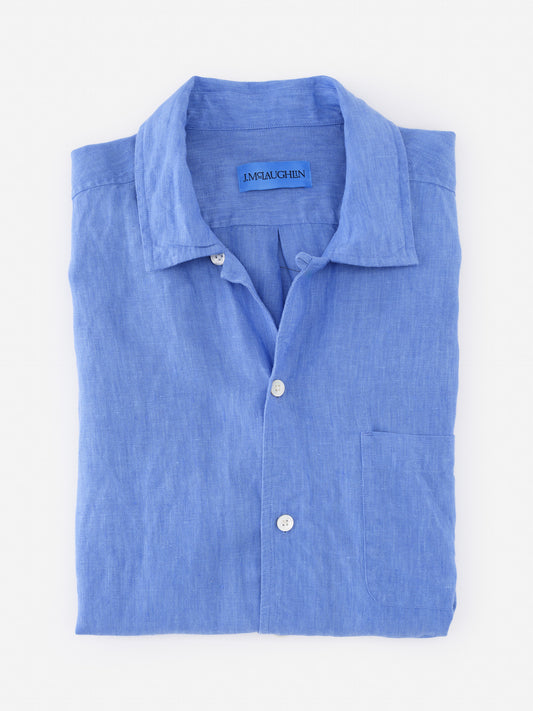 Folded Montauk Linen Shirt in soft blue by J.McLaughlin, showcasing effortlessly stylish design and innovative fabrics for enduring fashion. A destination for defining style. Life, Well-Lived.