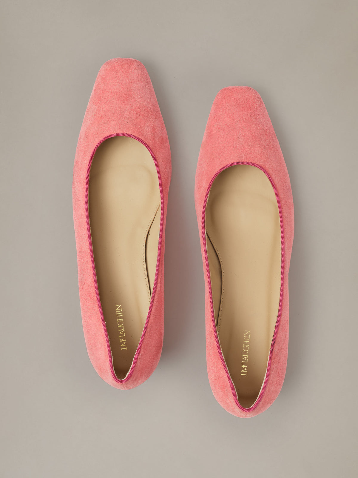 Josie Suede Pumps in soft pink suede shown from above as a classic pair of shoes with sleek rounded toes and low heels