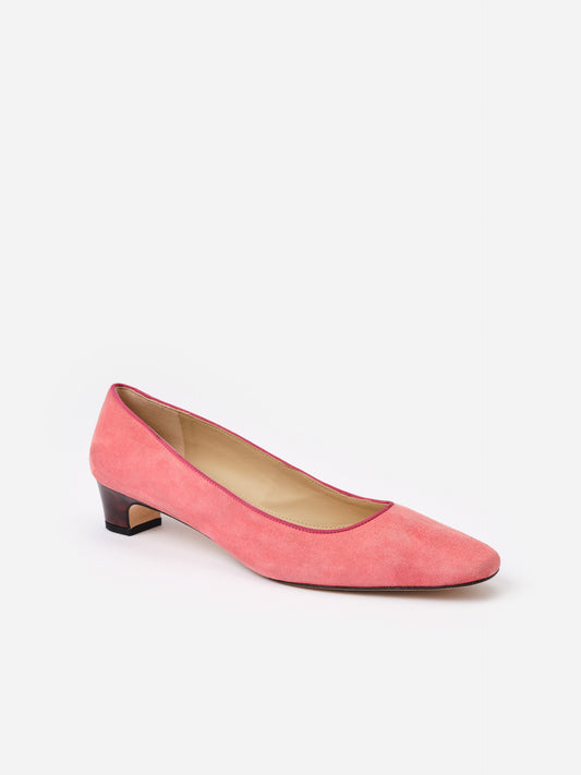 Josie Suede Pumps by J.McLaughlin in coral pink suede with a low tortoise-patterned heel, showcasing effortlessly stylish and enduring designs for everyday elegance.