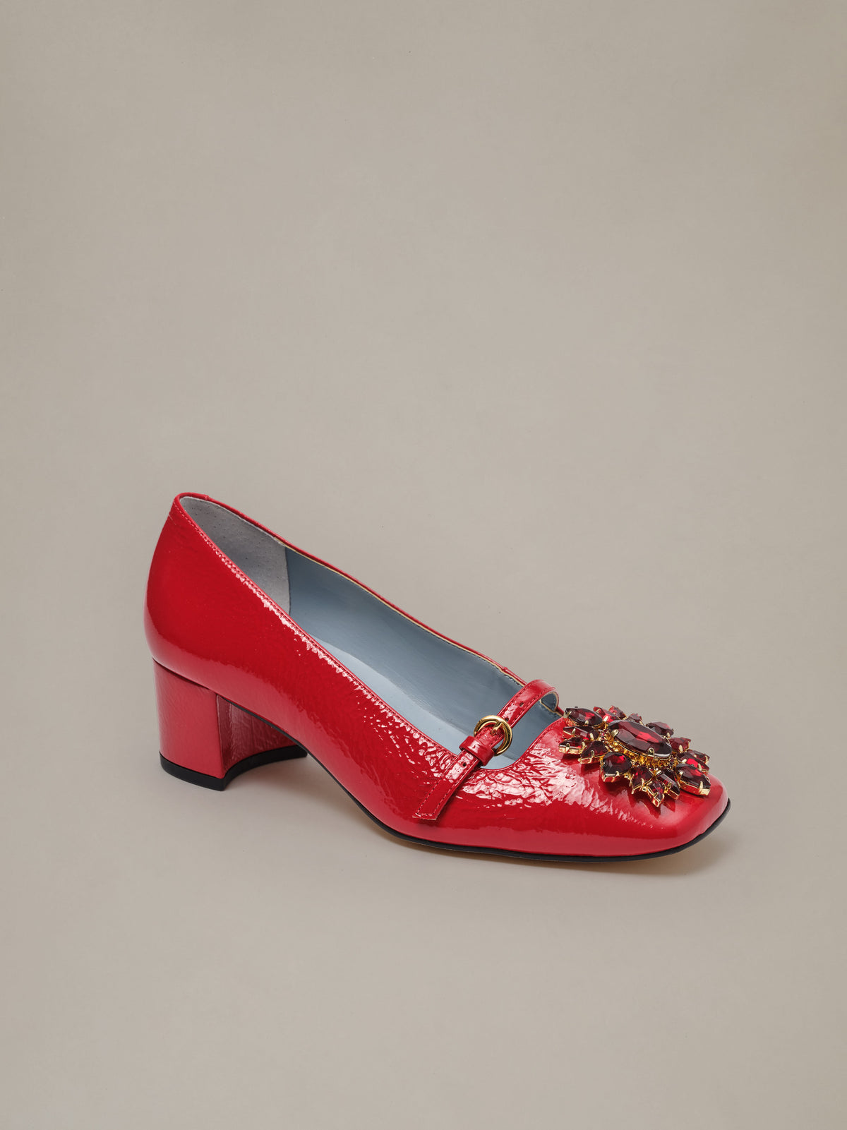 Jojo Leather Mary Jane Pumps by J.McLaughlin in red patent leather with a square toe floral rosette buckle Mary Jane strap and low block heel