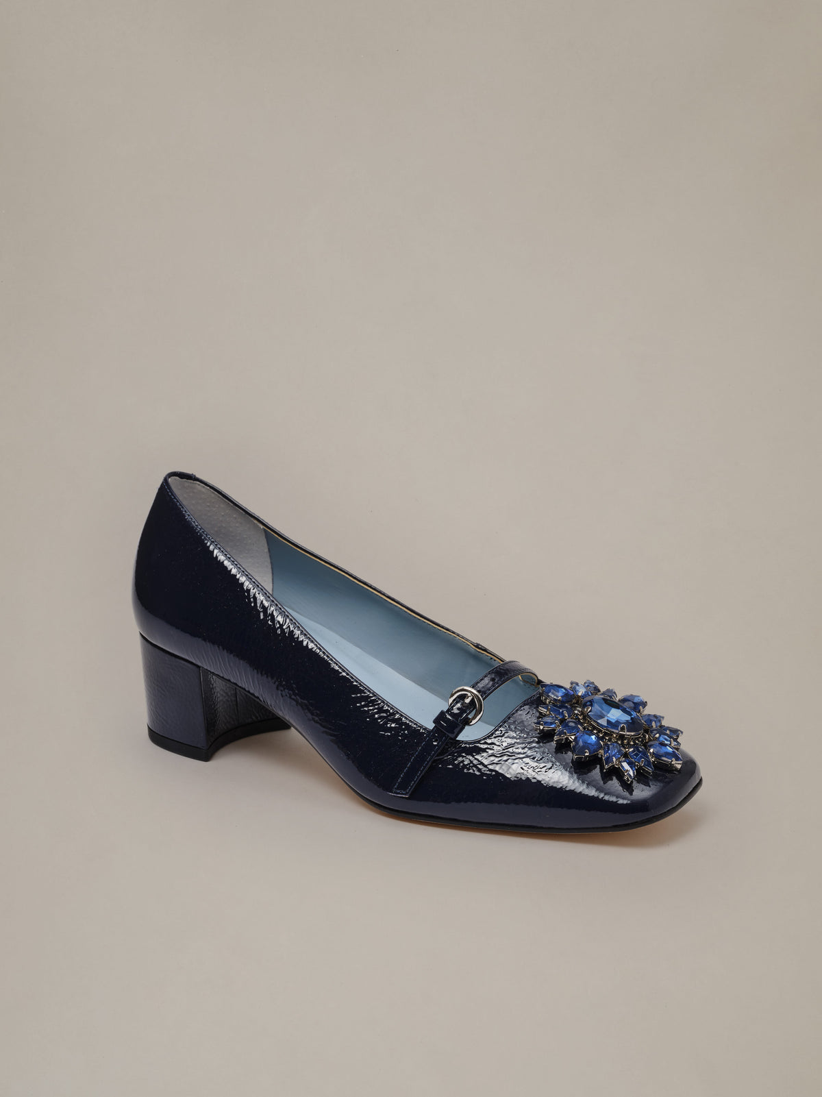 Jojo Leather Mary Jane Pumps by J.McLaughlin in glossy navy leather with a square toe floral rosette buckle and low block heel