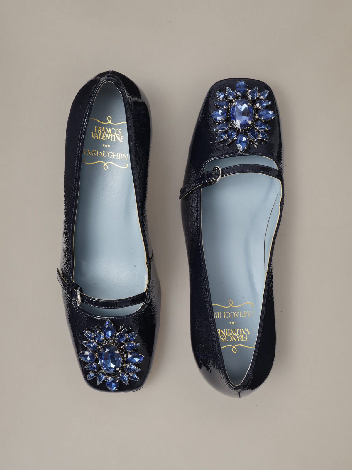 J.McLaughlin Jojo Leather Mary Jane Pumps in black leather with blue jeweled floral embellishments and adjustable straps shown from above