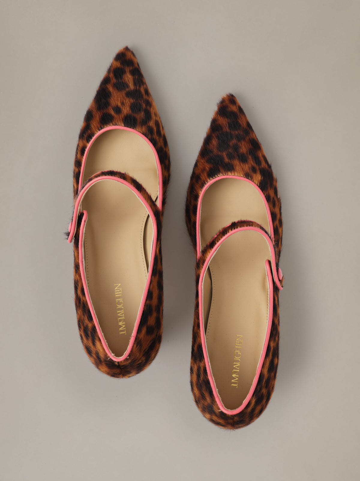 Katie Calf Hair Pumps in Leopard by J.McLaughlin featuring pointed toes pink trim and classic Mary Jane straps on a sleek 2¾ inch heel