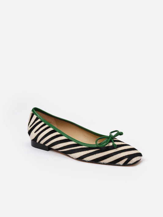 Viola Pony Hair Ballet Flats in Zebra by J.McLaughlin featuring black and white zebra stripes with green trim and bow, blending classic style with effortless elegance.