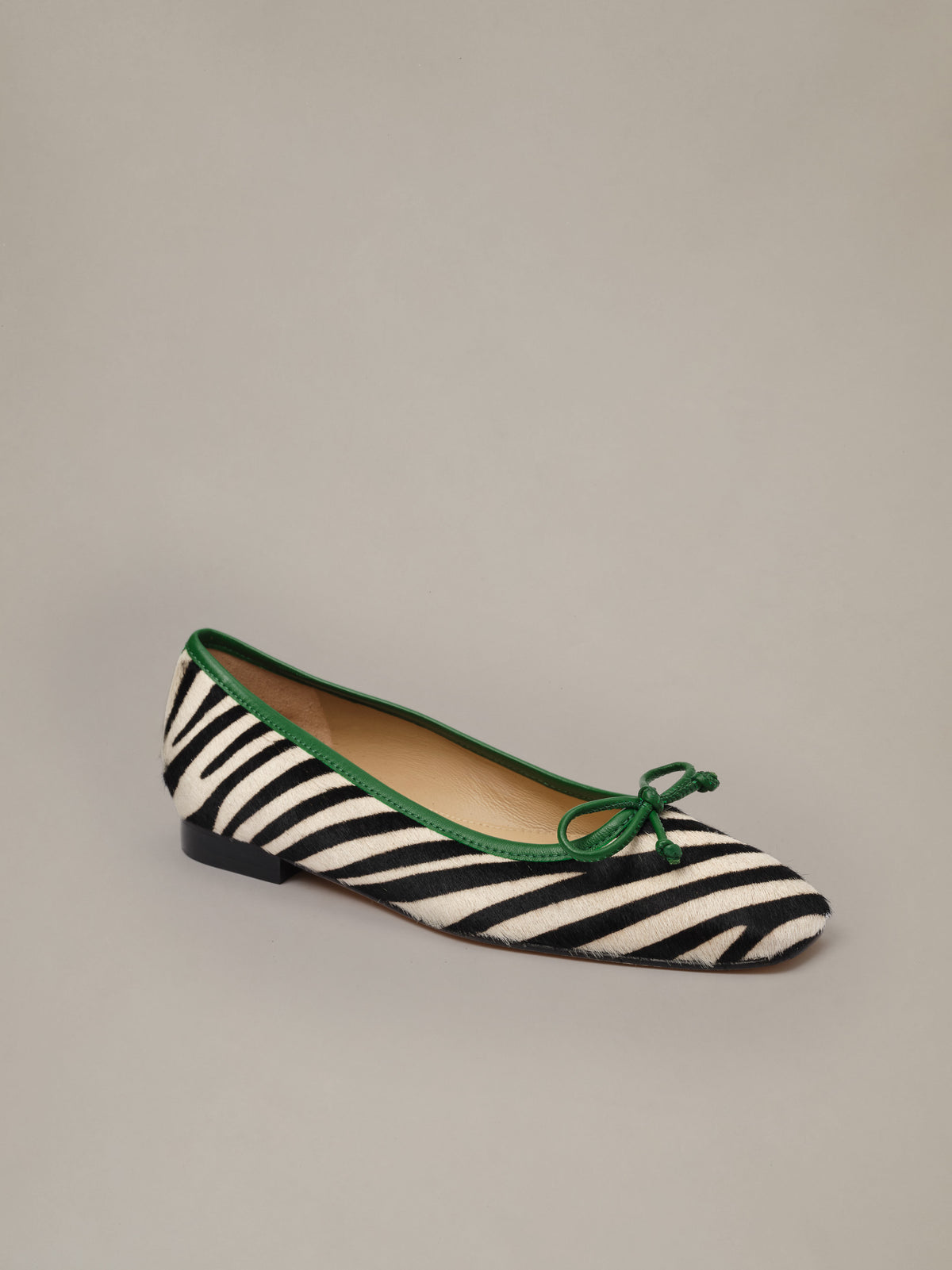 Viola Pony Hair Ballet Flats in Zebra by J.McLaughlin with a square toe black and cream zebra stripes green trim and a delicate bow detail