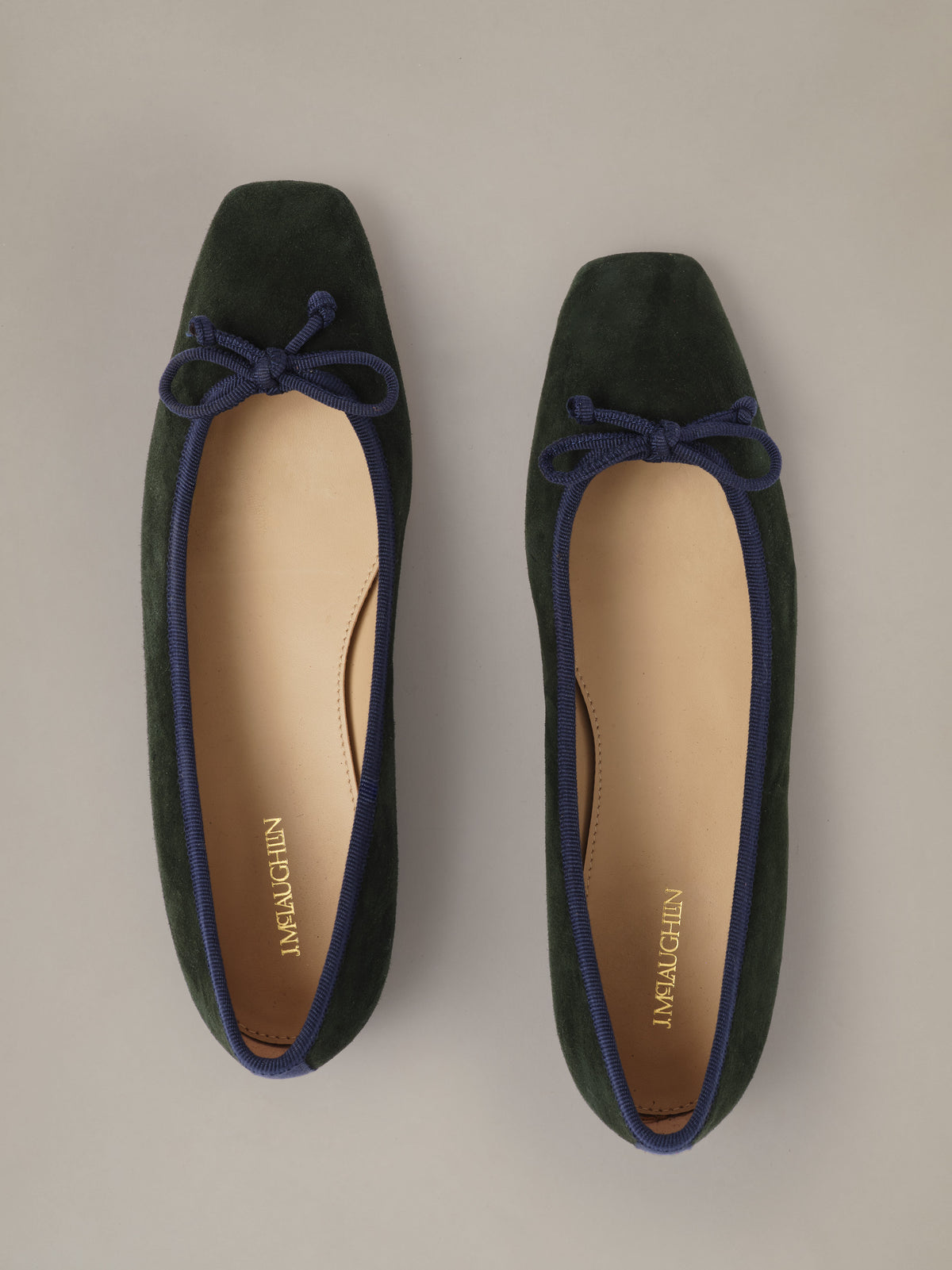 Viola Suede Ballet Flats by J.McLaughlin in dark suede with square toes and navy bow details shown from above.