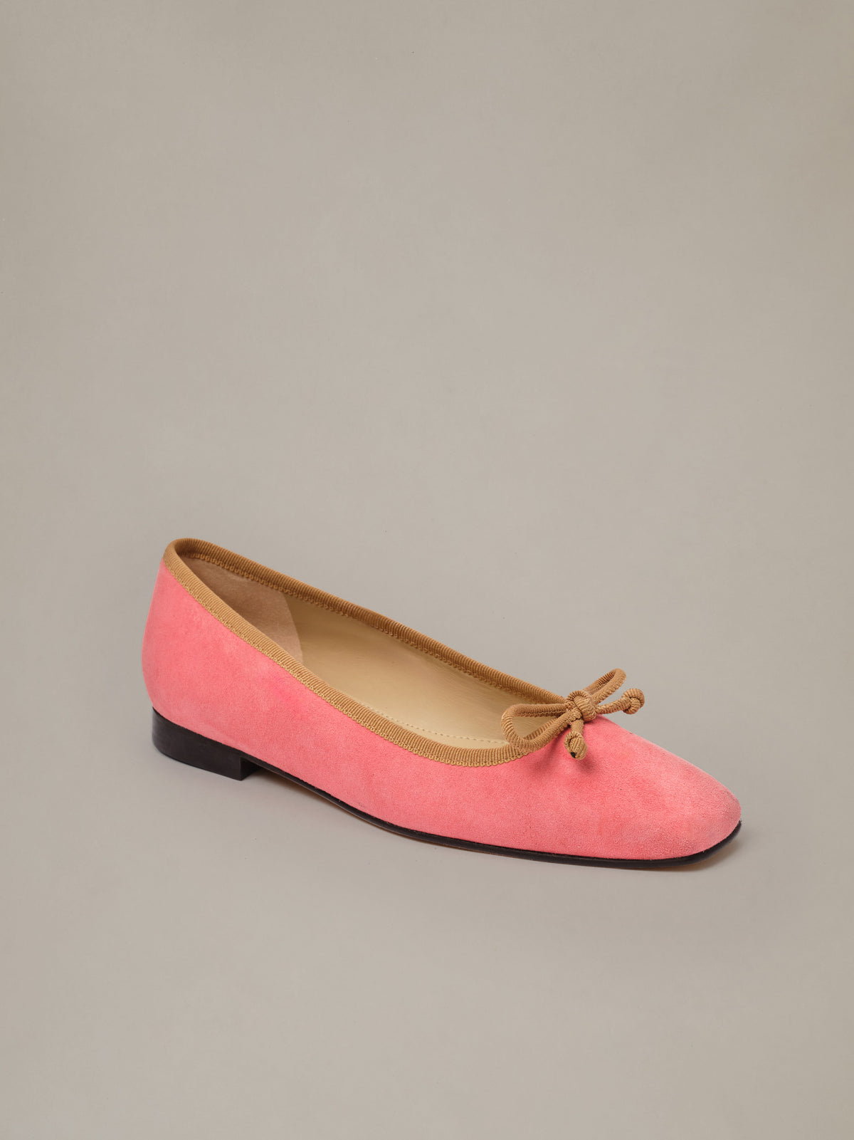 Viola Suede Ballet Flats by J.McLaughlin in coral pink suede with a structured square toe delicate bow detail and low black heel