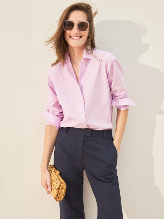 Model wearing J.McLaughlin Finn shirt in pink made with cotton.