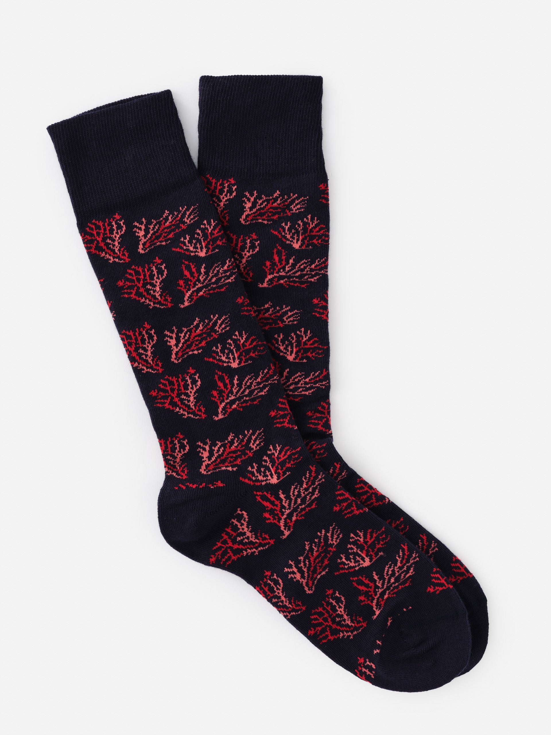Pair of Socks in Midi Coral Cay Texture featuring coral-inspired pattern in red on navy, showcasing J.McLaughlin's legacy of timeless fashion with effortlessly stylish, enduring designs.