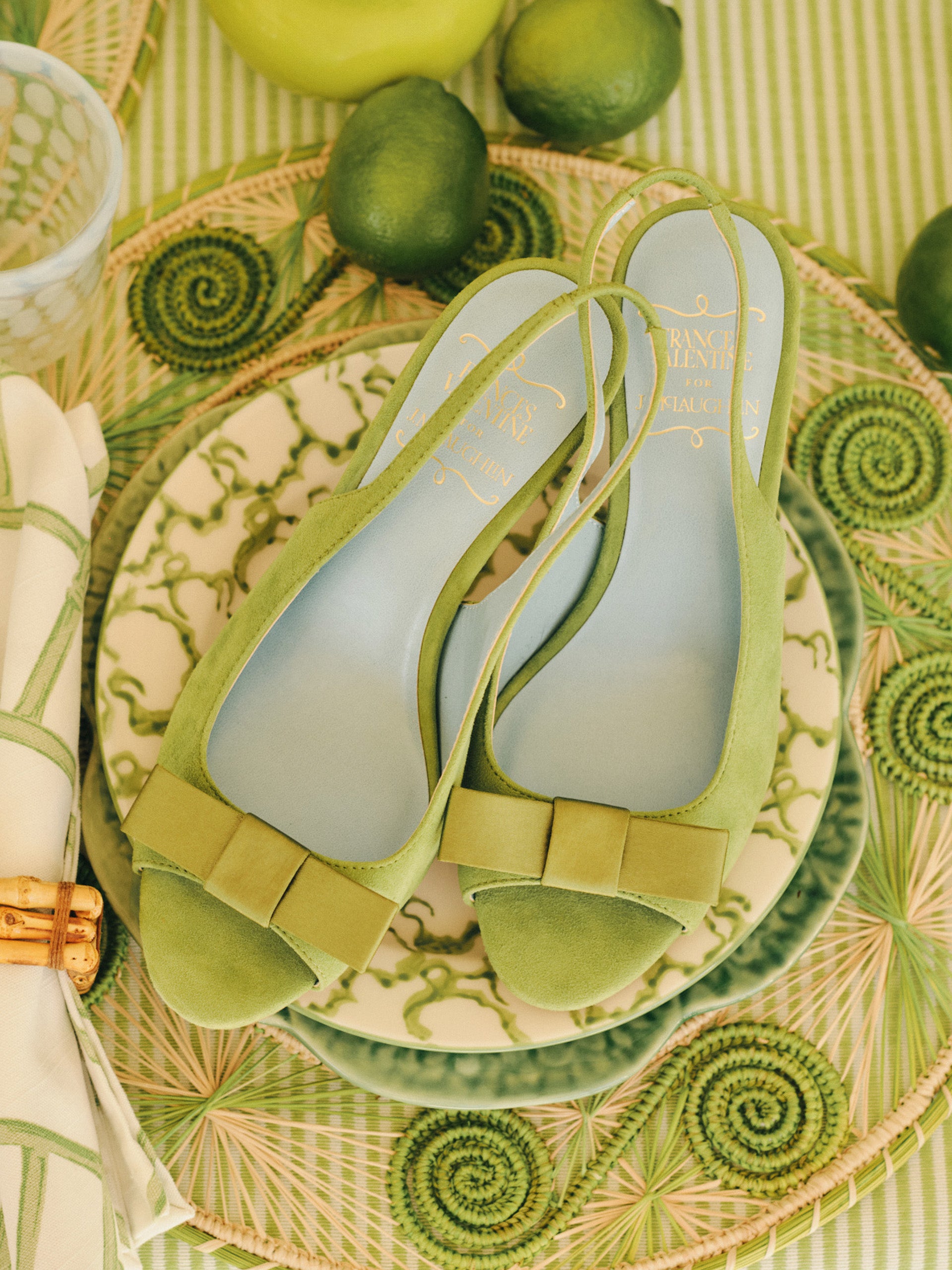 Reese Suede Slingbacks in soft green suede with a bow detail, styled by J.McLaughlin, embody effortlessly stylish, enduring designs and innovative fabrics for a legacy of timeless fashion.
