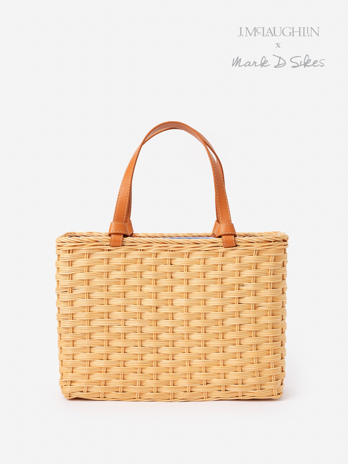 Woven Caroline Wicker Handbag by J.McLaughlin featuring leather handles, combining effortlessly stylish design and enduring craftsmanship for a legacy of timeless fashion.