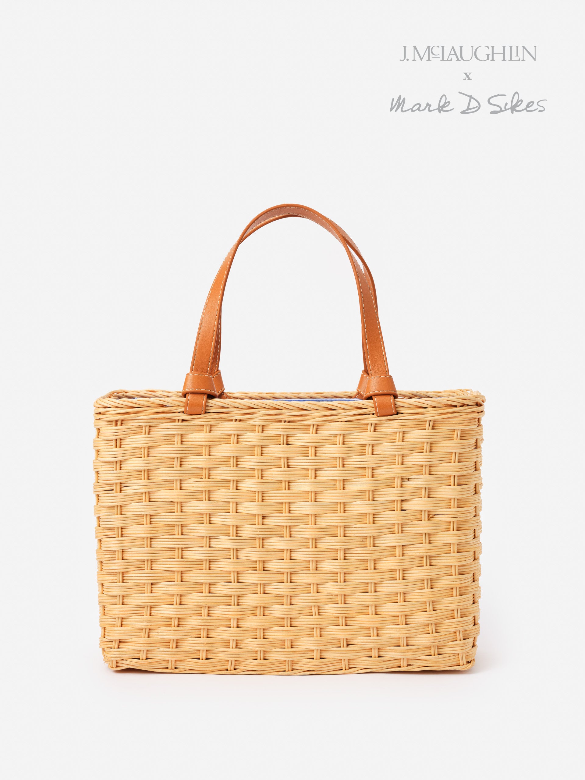 Woven Caroline Wicker Handbag by J.McLaughlin featuring leather handles, combining effortlessly stylish design and enduring craftsmanship for a legacy of timeless fashion.