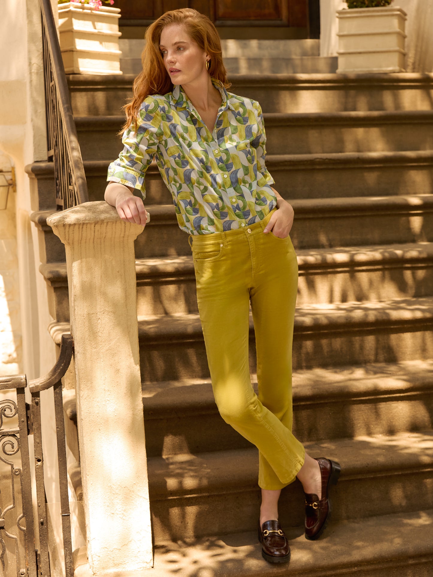 Model wearing J.McLaughlin Lenni jeans in chartreuse made with velveteen.