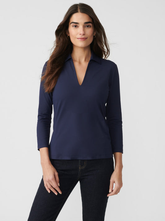 Model wearing J.McLaughlin Aida 3/4 sleeve top in winter navy made with Catalina cloth.