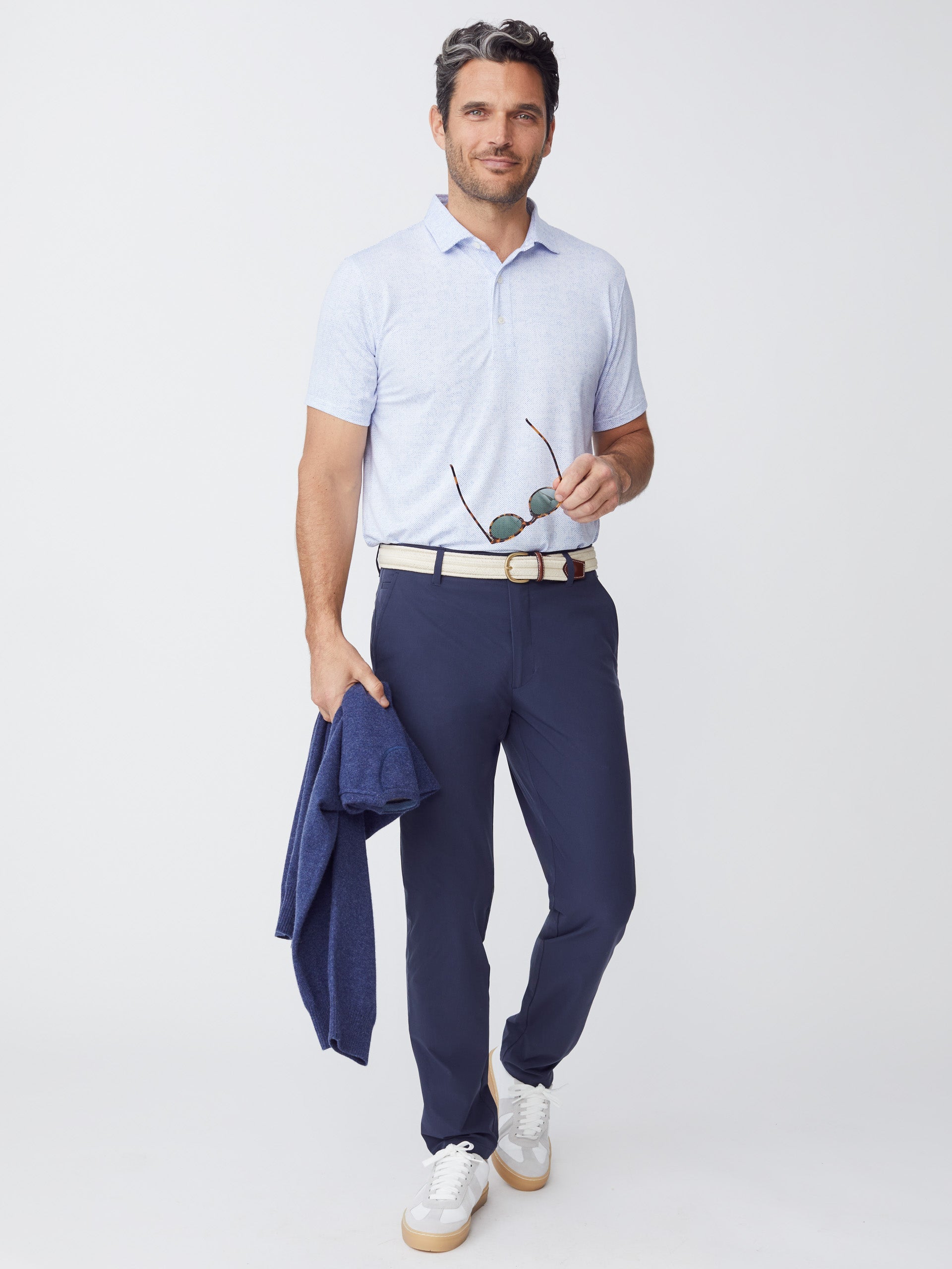 Model wearing J.McLaughlin Akin pants in navy made with Performance fabric.