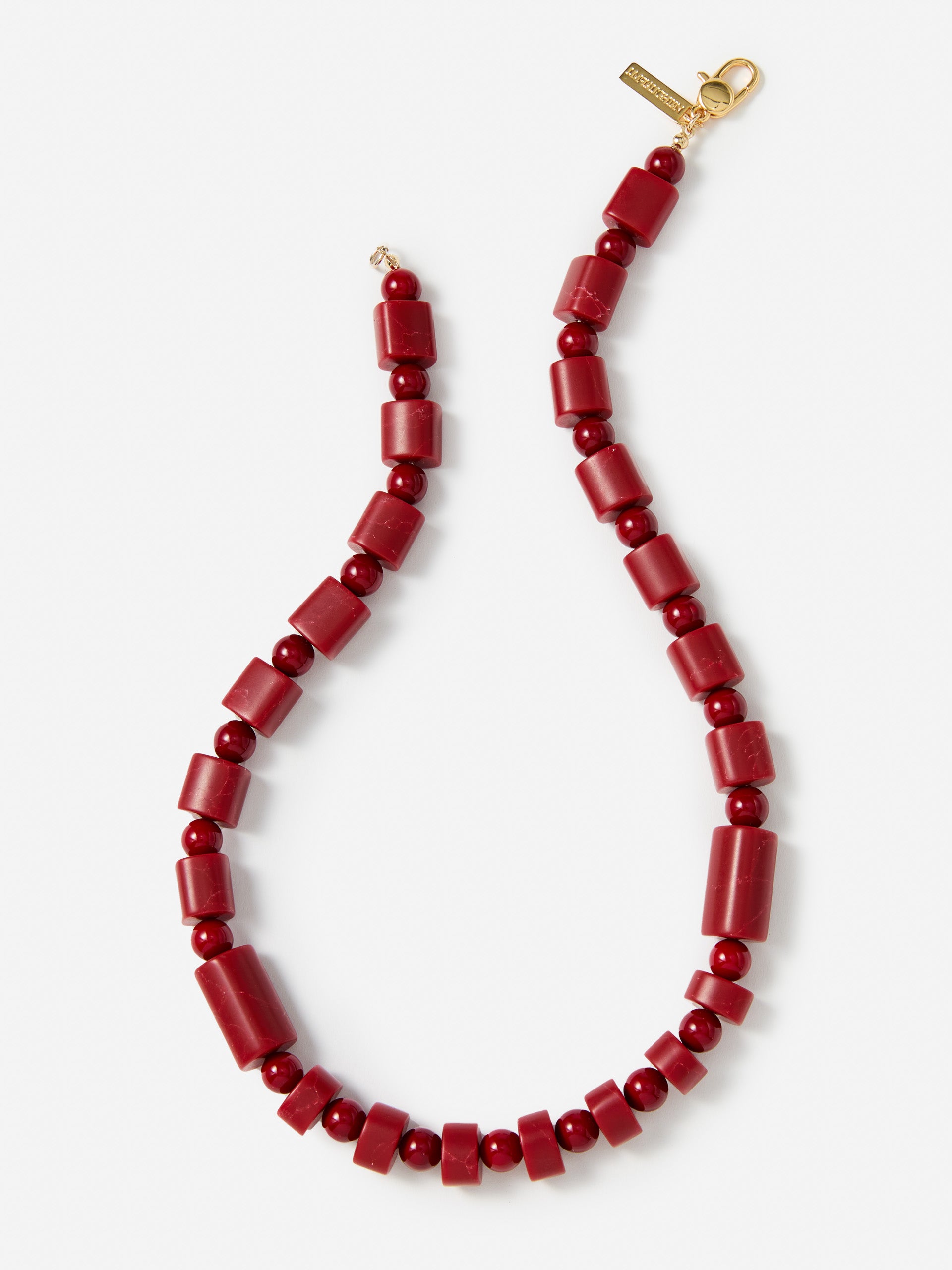 J.McLaughlin Amber bead necklace in red made with brass and resin.