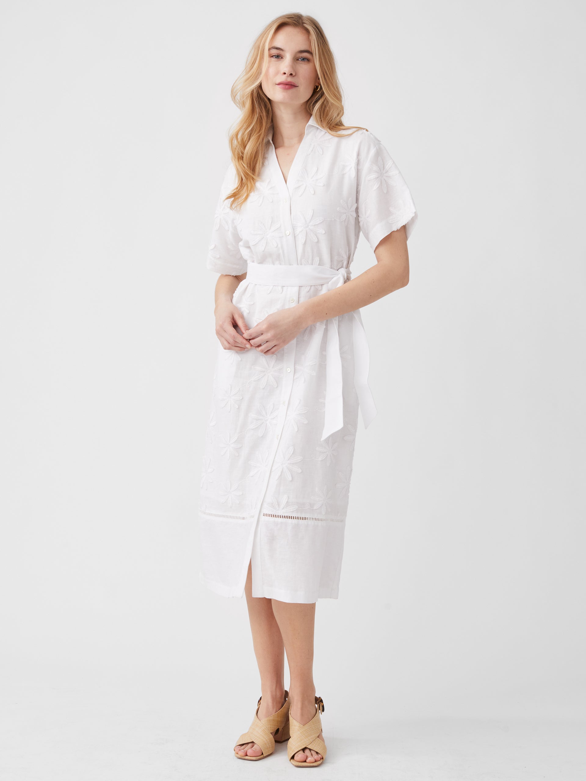Model wearing J.McLaughlin Anamaria dress in white made with linen and cotton.
