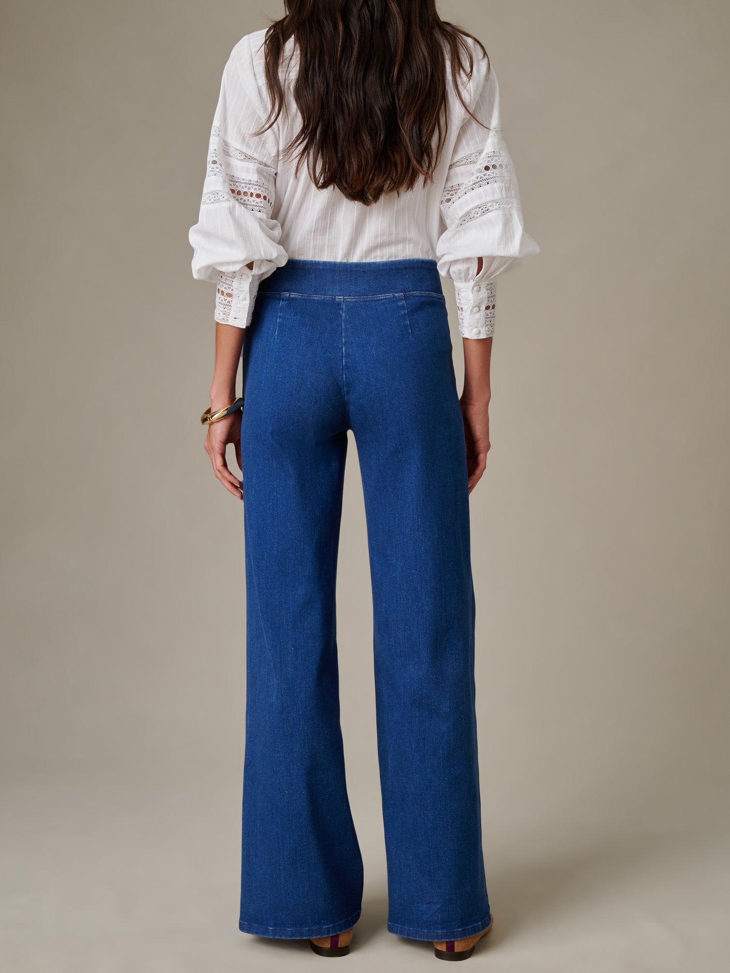 Woman wearing Anderson Jeans by J.McLaughlin, showcasing effortlessly stylish, enduring design in a timeless classic fit, perfect for a life well-lived.