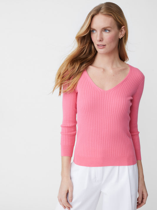 Model wearing J.McLaughlin Anouk sweater in blushing pink made with cotton/modal.