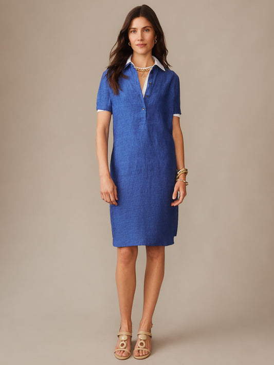 A woman wearing the Arissa Linen Dress in rich denim blue by J.McLaughlin, showcasing effortlessly stylish, enduring designs with innovative fabrics for a legacy of timeless fashion. A destination for defining style. Life, Well-Lived.