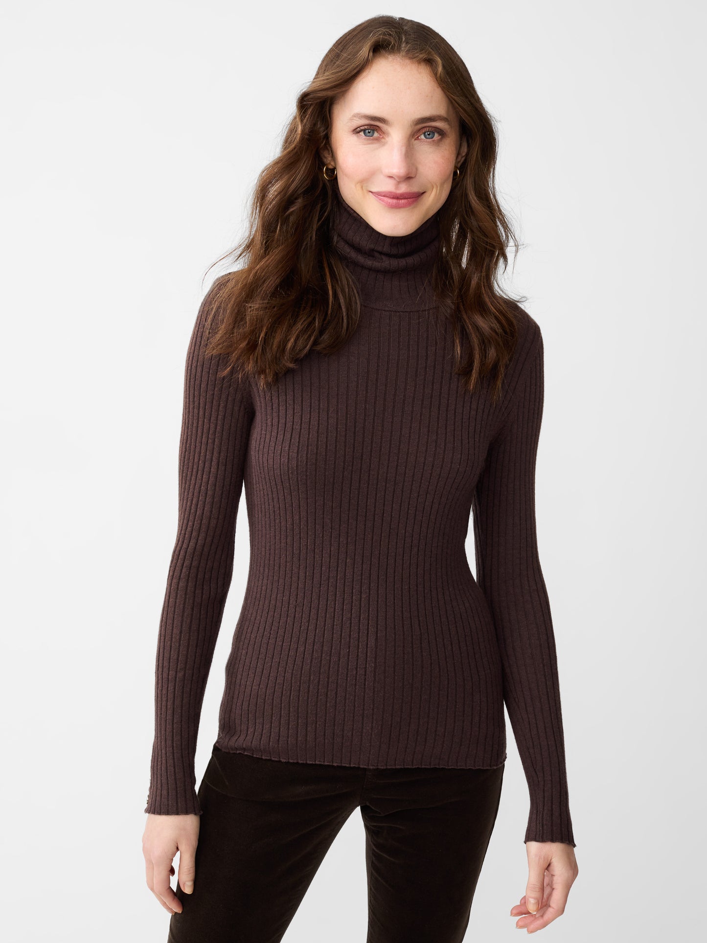 Model wearing J.McLaughlin Arlette turtleneck in heather brown made with cotton/modal.