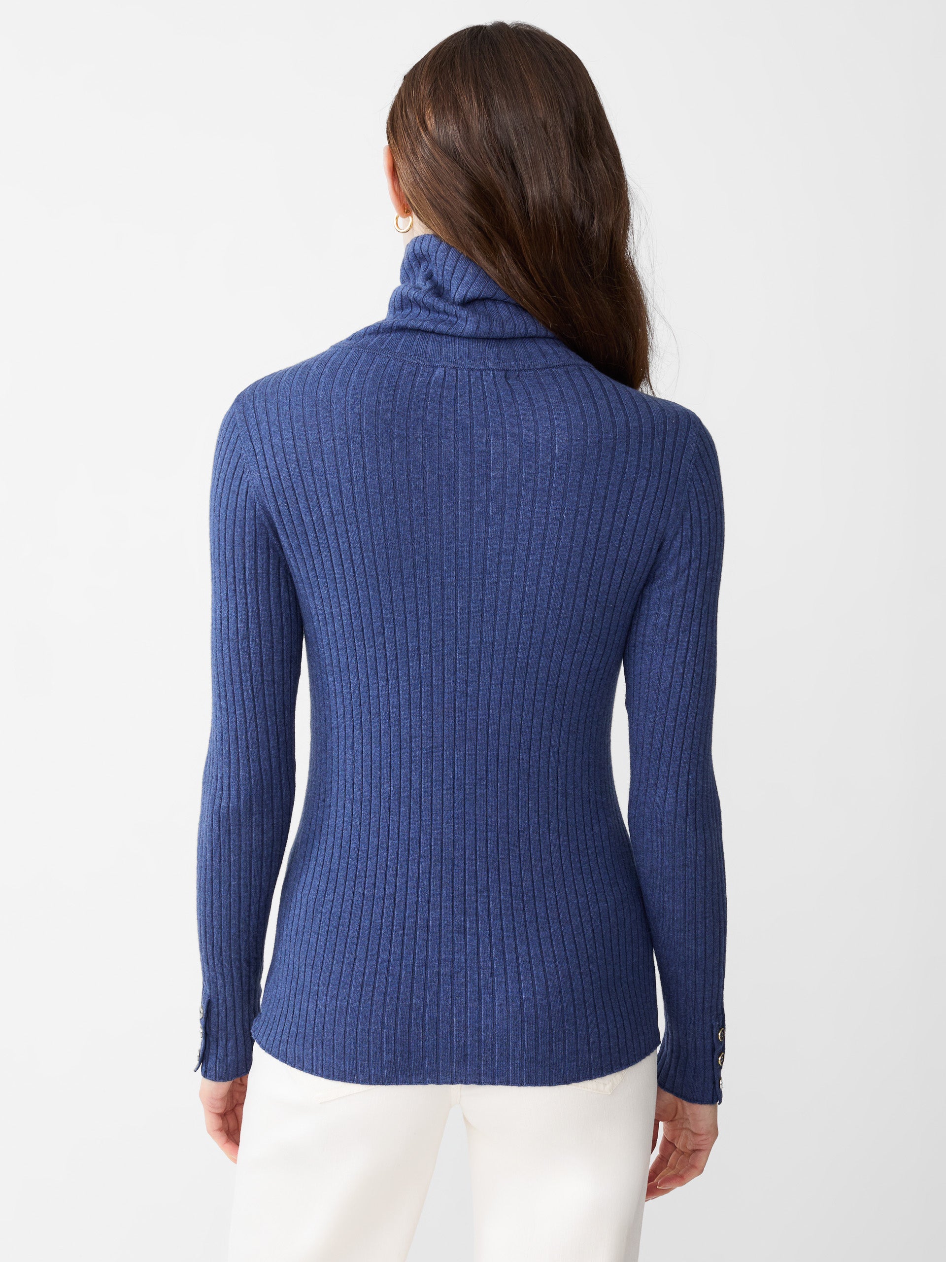 Model wearing J.McLaughlin Arlette turtleneck in denim made with cotton/modal.