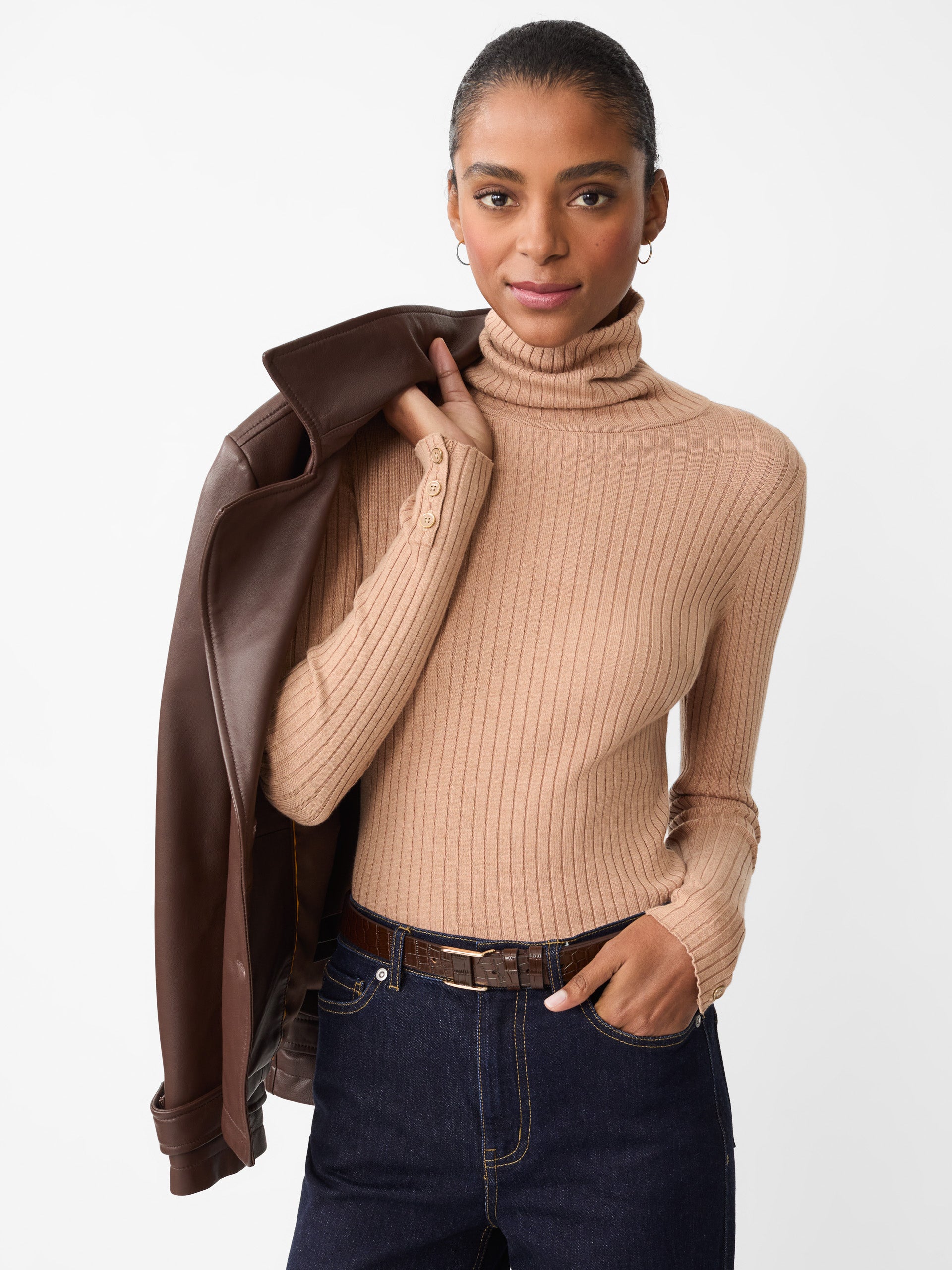 Model wearing J.McLaughlin Arlette turtleneck in heather camel made with cotton/modal.