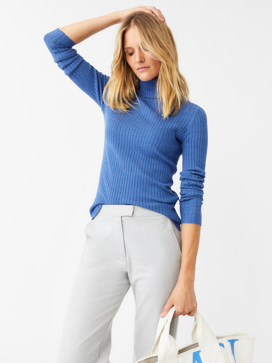 Model wearing J.McLaughlin Arlette turtleneck in heather chambray made with cotton/modal.
