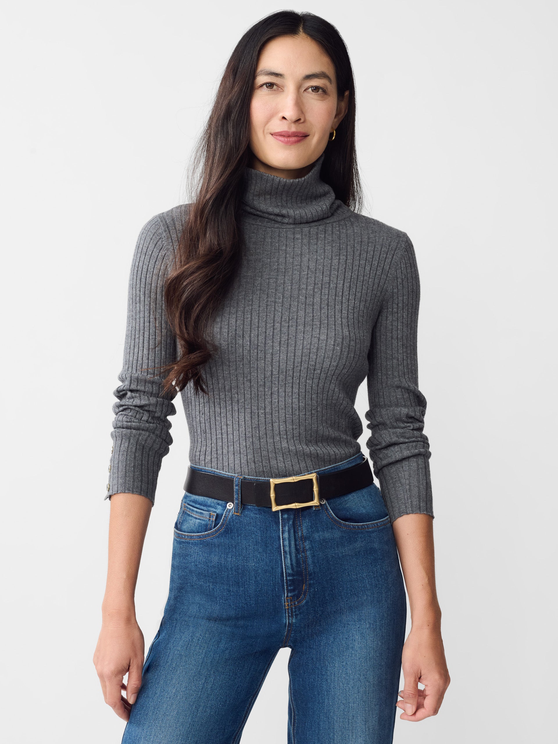 Model wearing J.McLaughlin Arlette turtleneck in heather gray made with cotton/modal.