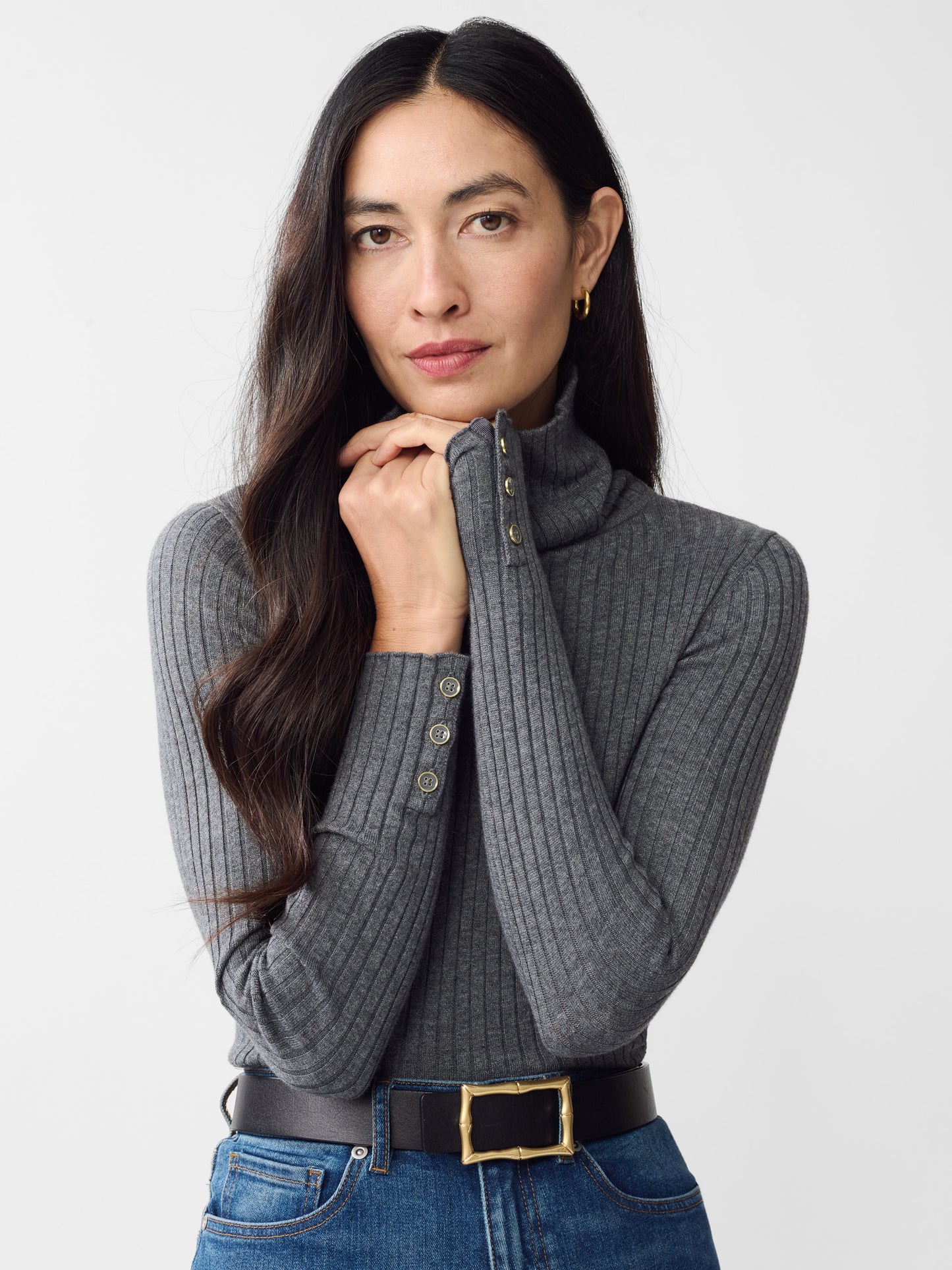 Model wearing J.McLaughlin Arlette turtleneck in heather gray made with cotton/modal.