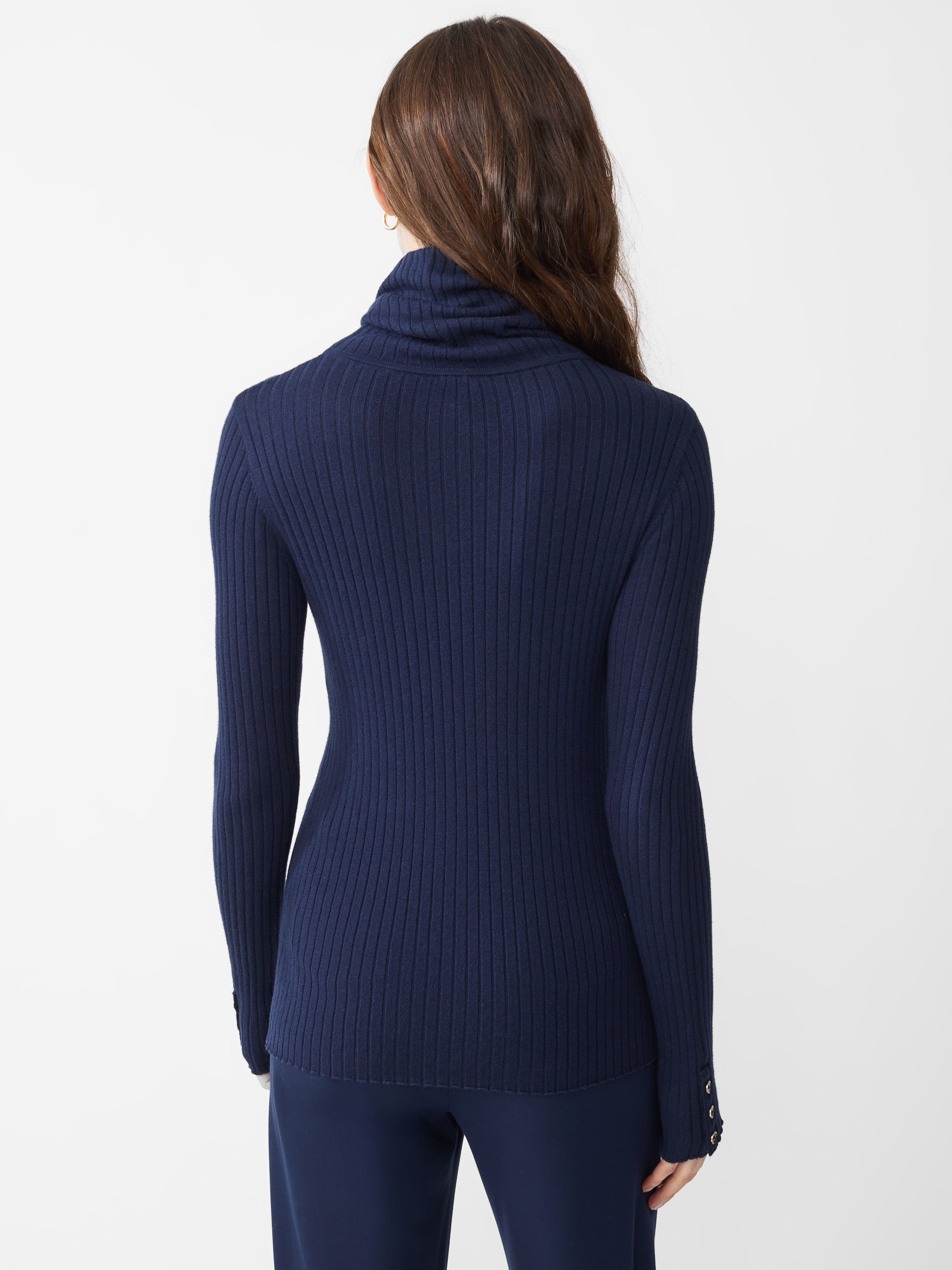 Model wearing J.McLaughlin Arlette turtleneck in navy made with cotton/modal.