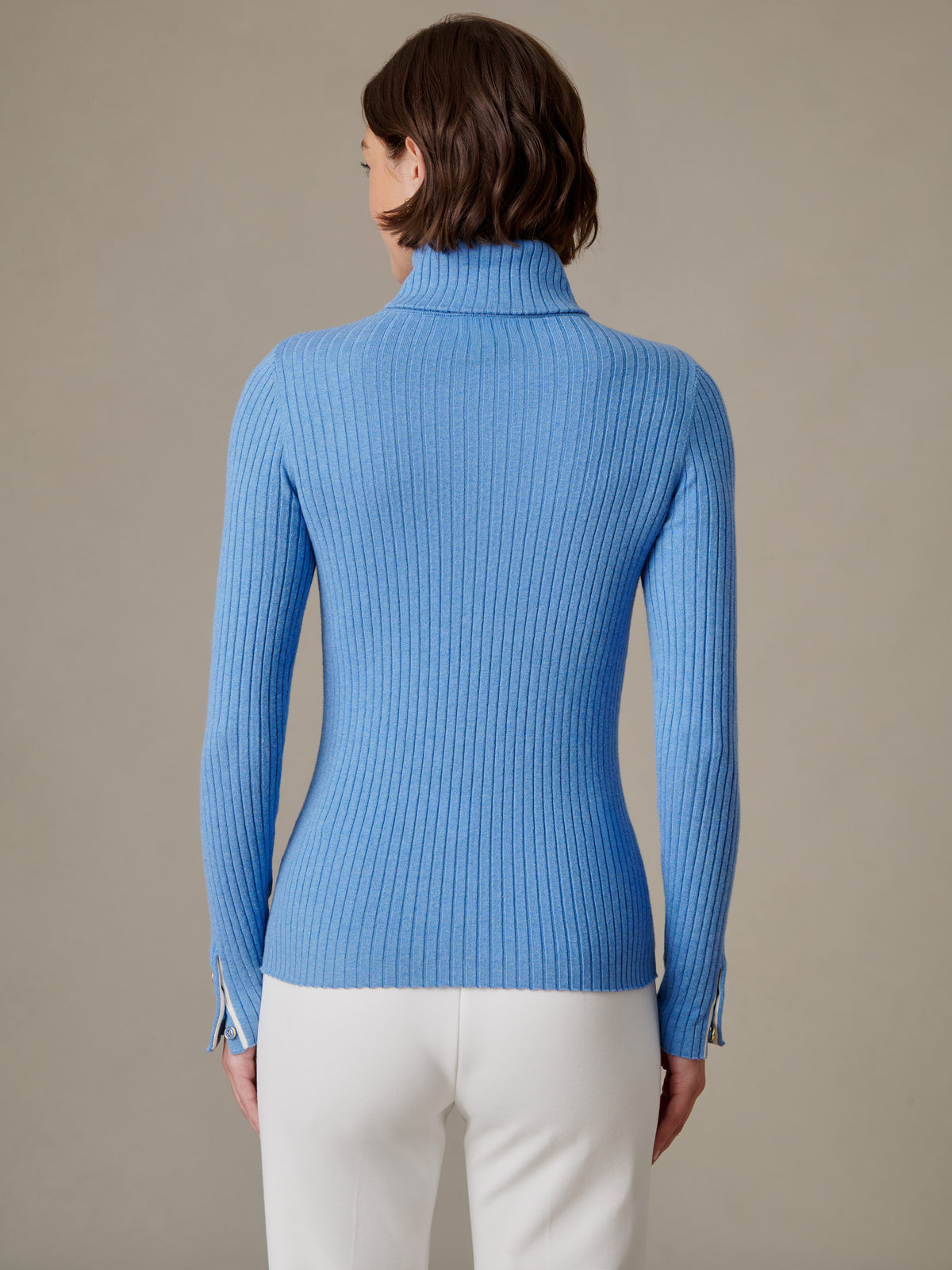 J.McLaughlin Arlette Turtleneck in blue finely ribbed stretch cotton modal with a high neck long sleeves and button cuffs shown from the back