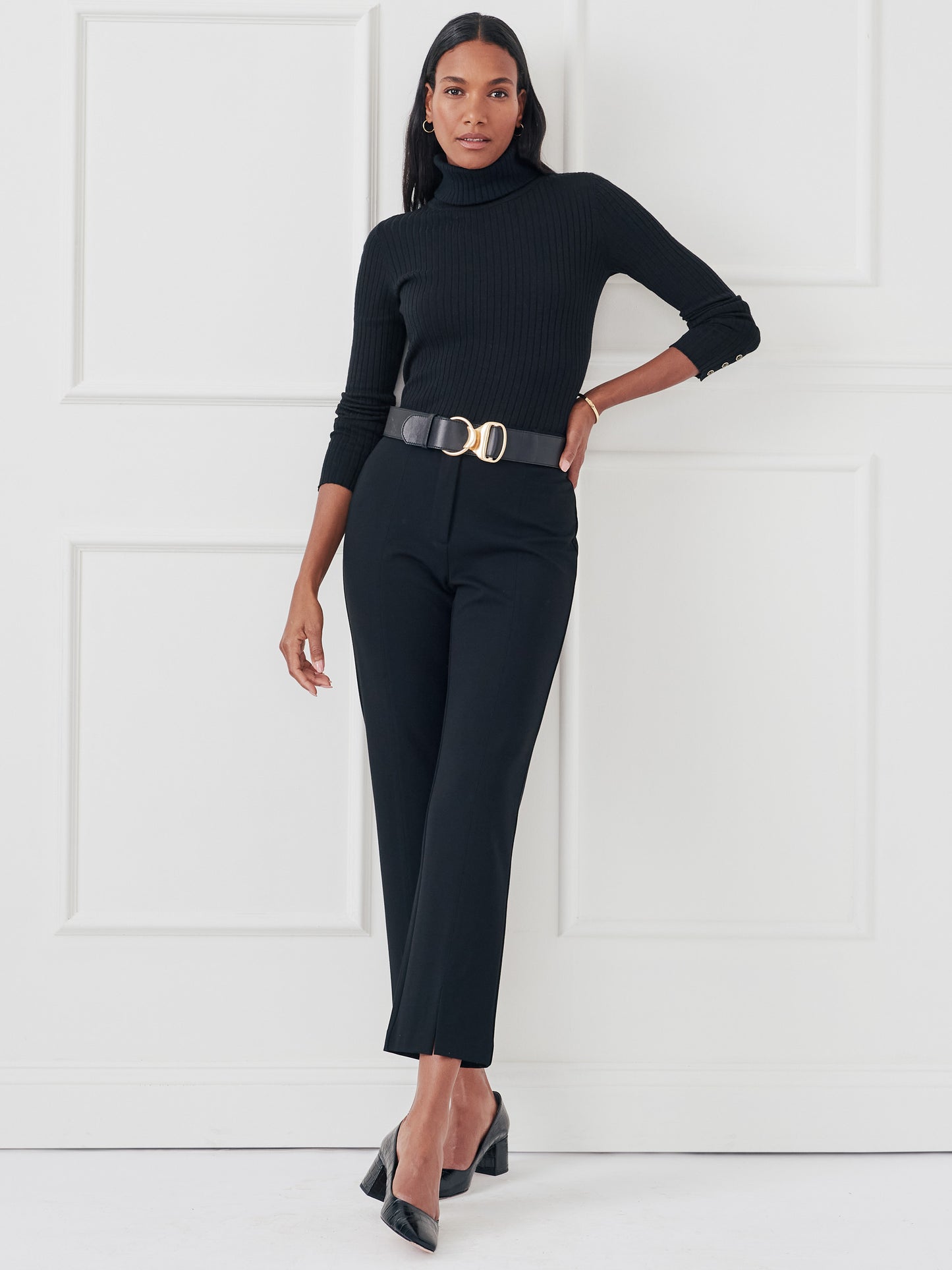 Model wearing J.McLaughlin Arlette turtleneck in black made with cotton/modal.