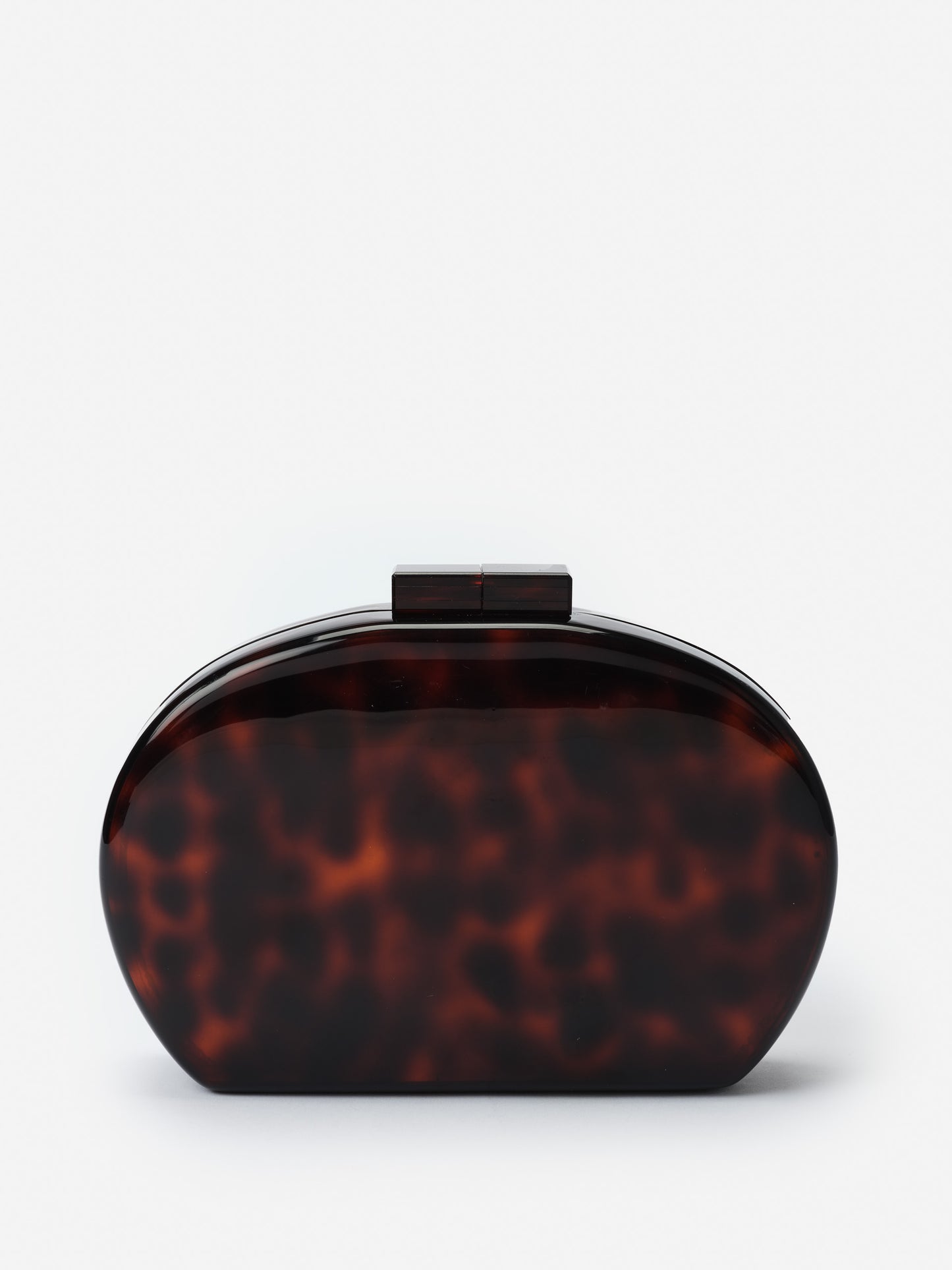 Arya Clutch in Tortoise by J.McLaughlin, an effortlessly stylish bag featuring enduring designs and innovative materials, embodying a legacy of timeless fashion. A destination for defining style. Life, Well-Lived.
