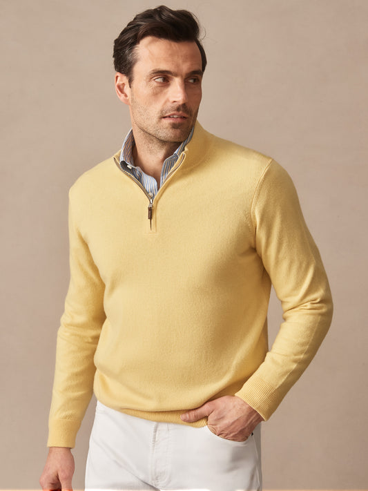 Man wearing a yellow Twain Cashmere 1/4 Zip sweater by J.McLaughlin, showcasing effortlessly stylish, enduring designs crafted from innovative fabrics, perfect for a life well-lived.