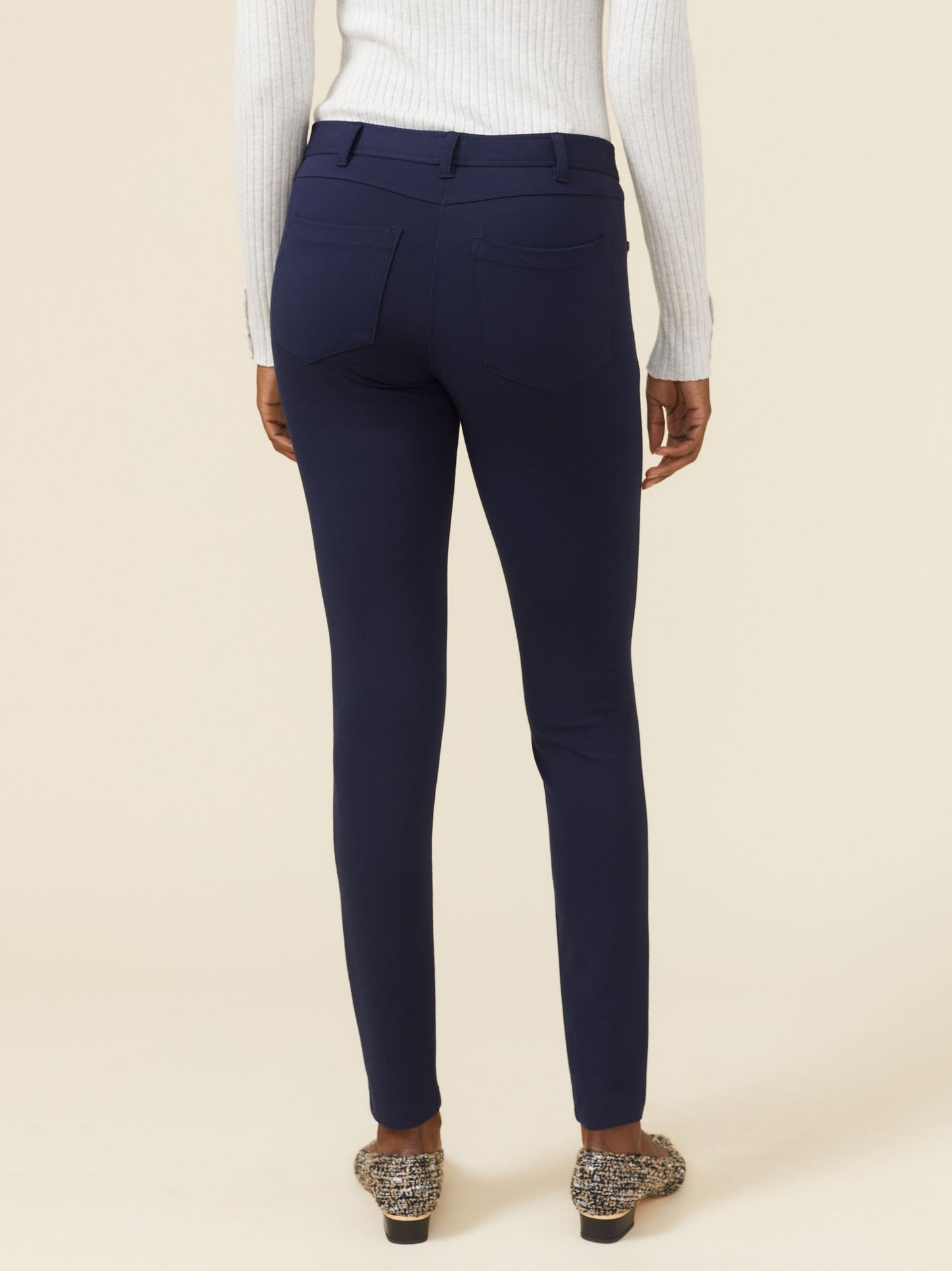 Model wearing J.McLaughlin Becca leggings in winter navy made with Bainbridge fabric.