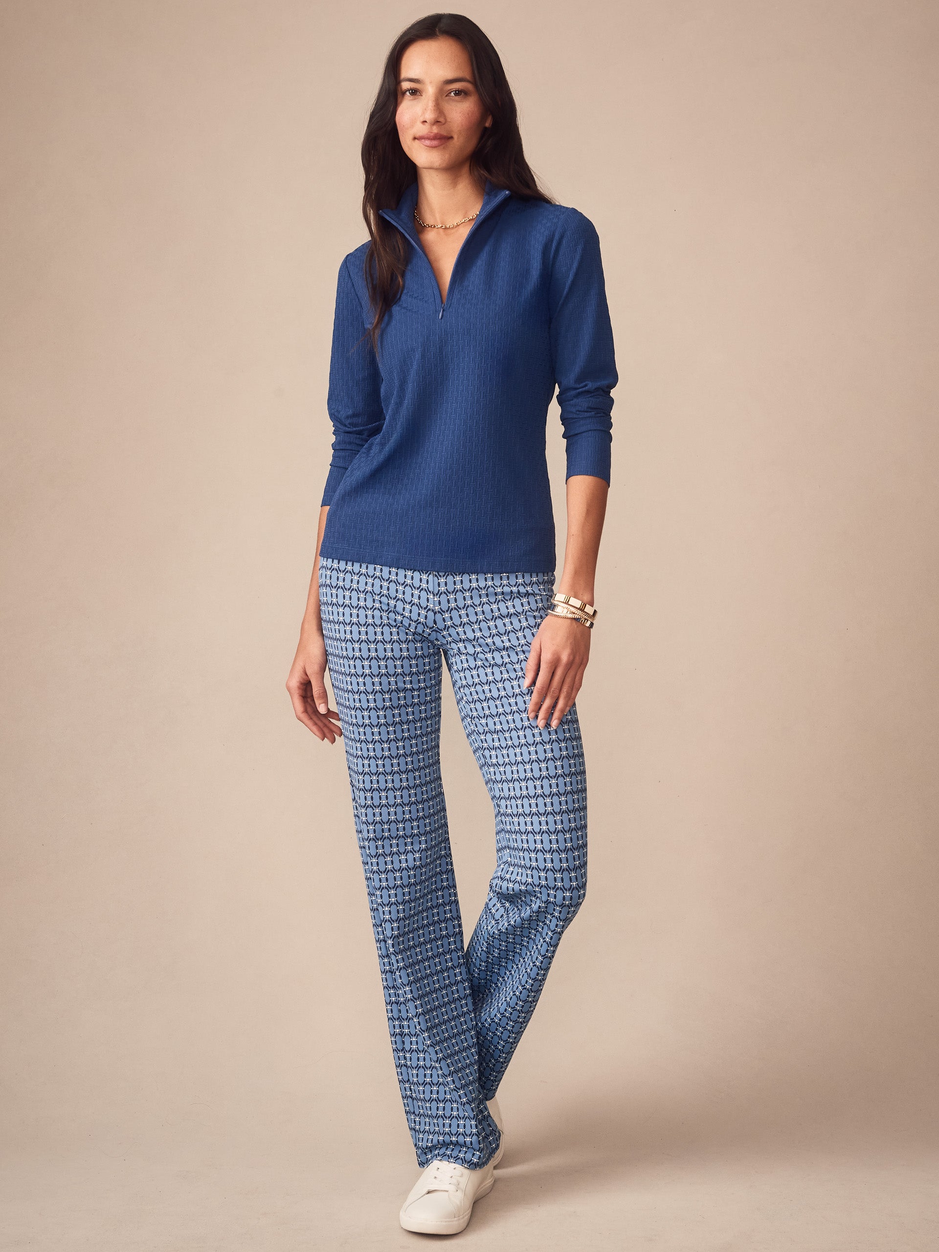 Woman wearing a blue Bedford Top in Dashing Jacquard by J.McLaughlin, featuring effortlessly stylish design and innovative fabric for enduring appeal, a destination for defining style. Life, Well-Lived.