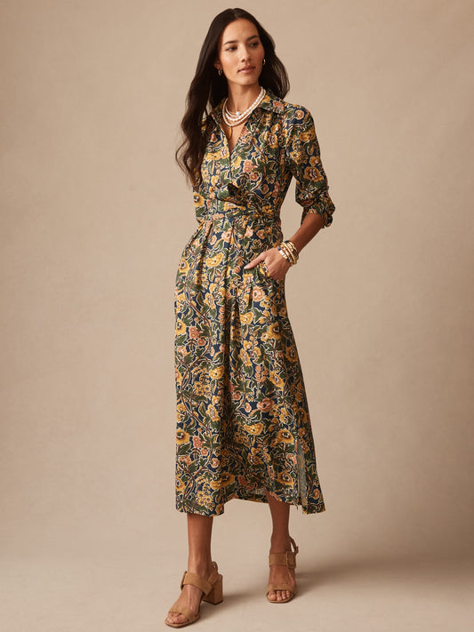 Woman wearing "Belle Dress in Bucolic Blooms" by J.McLaughlin, an effortlessly stylish floral dress with enduring designs and innovative fabric, embodying a legacy of timeless fashion. A destination for defining style. Life, Well-Lived.
