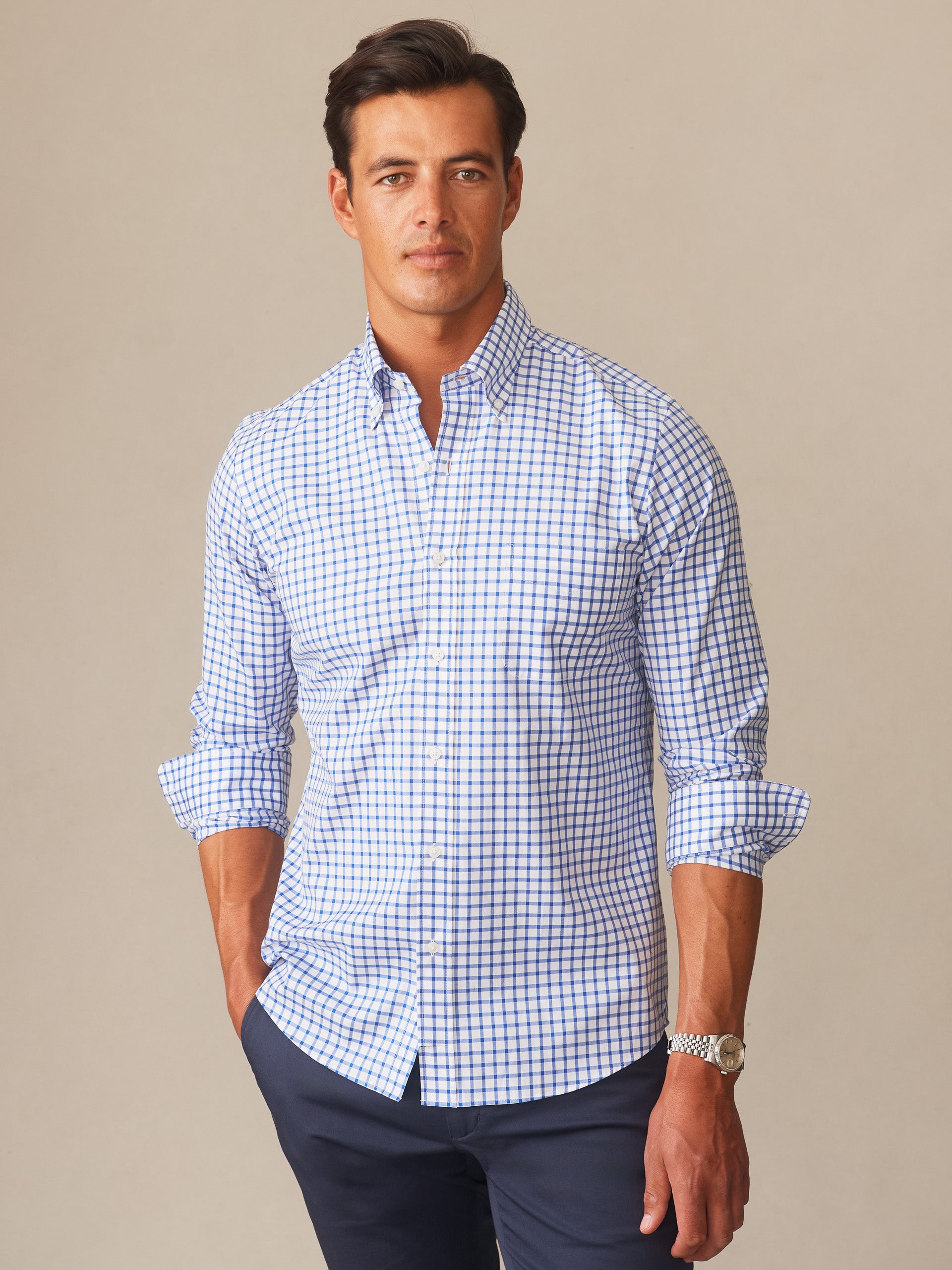 Man wearing a Belvedere Cotton Shirt in Check by J.McLaughlin, featuring a blue and white check pattern with effortlessly stylish design and enduring craftsmanship.