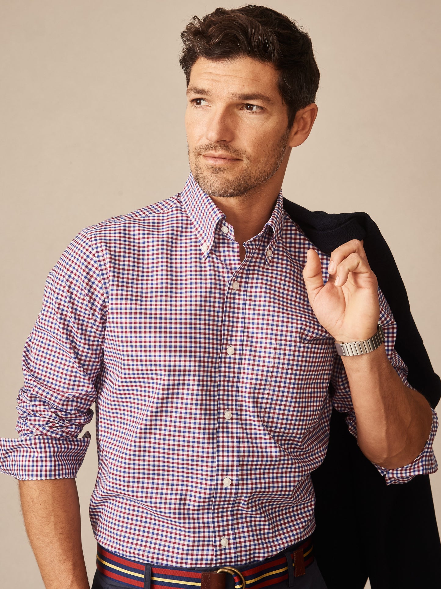 Man wearing a Belvedere Cotton Shirt in Gingham Multi by J.McLaughlin, featuring classic red, blue, and white checks, embodying effortlessly stylish, enduring designs with a legacy of timeless fashion. A destination for defining style. Life, Well-Lived.