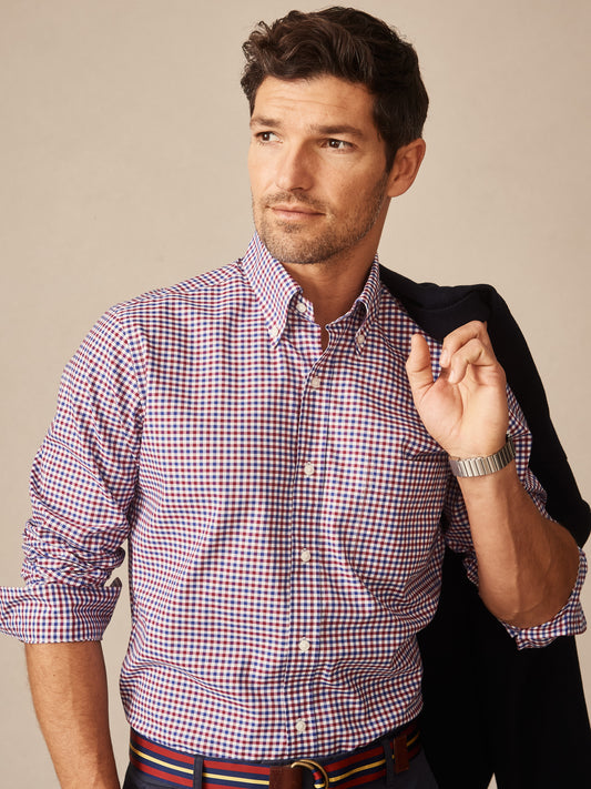 Man wearing a Belvedere Cotton Shirt in Gingham Multi by J.McLaughlin, featuring classic red, blue, and white checks, embodying effortlessly stylish, enduring designs with a legacy of timeless fashion. A destination for defining style. Life, Well-Lived.