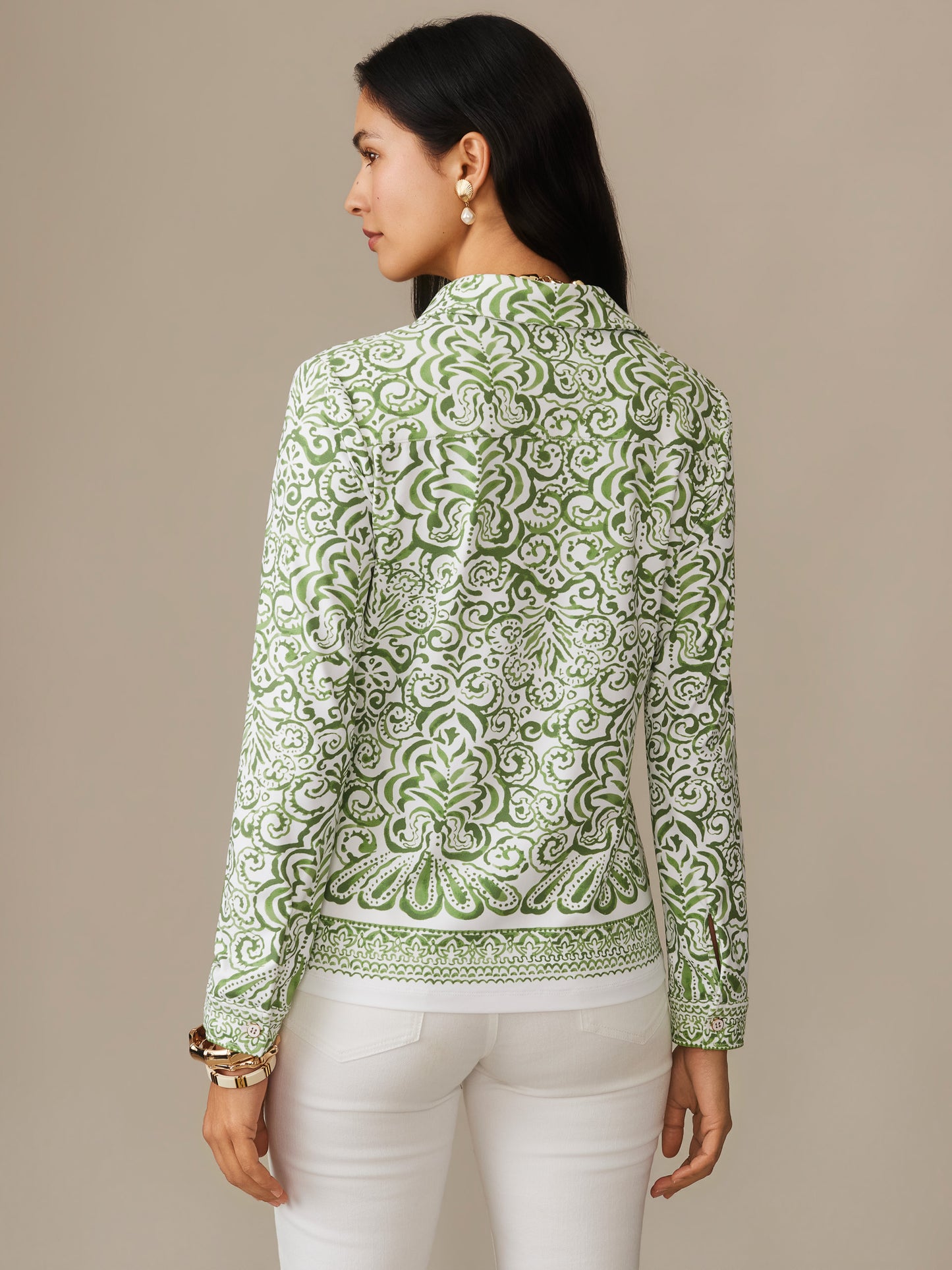 Woman wearing a Betty Shirt in Faiz Edge by J.McLaughlin featuring an intricate green and white pattern, showcasing effortlessly stylish, enduring designs with a legacy of timeless fashion. A destination for defining style. Life, Well-Lived.