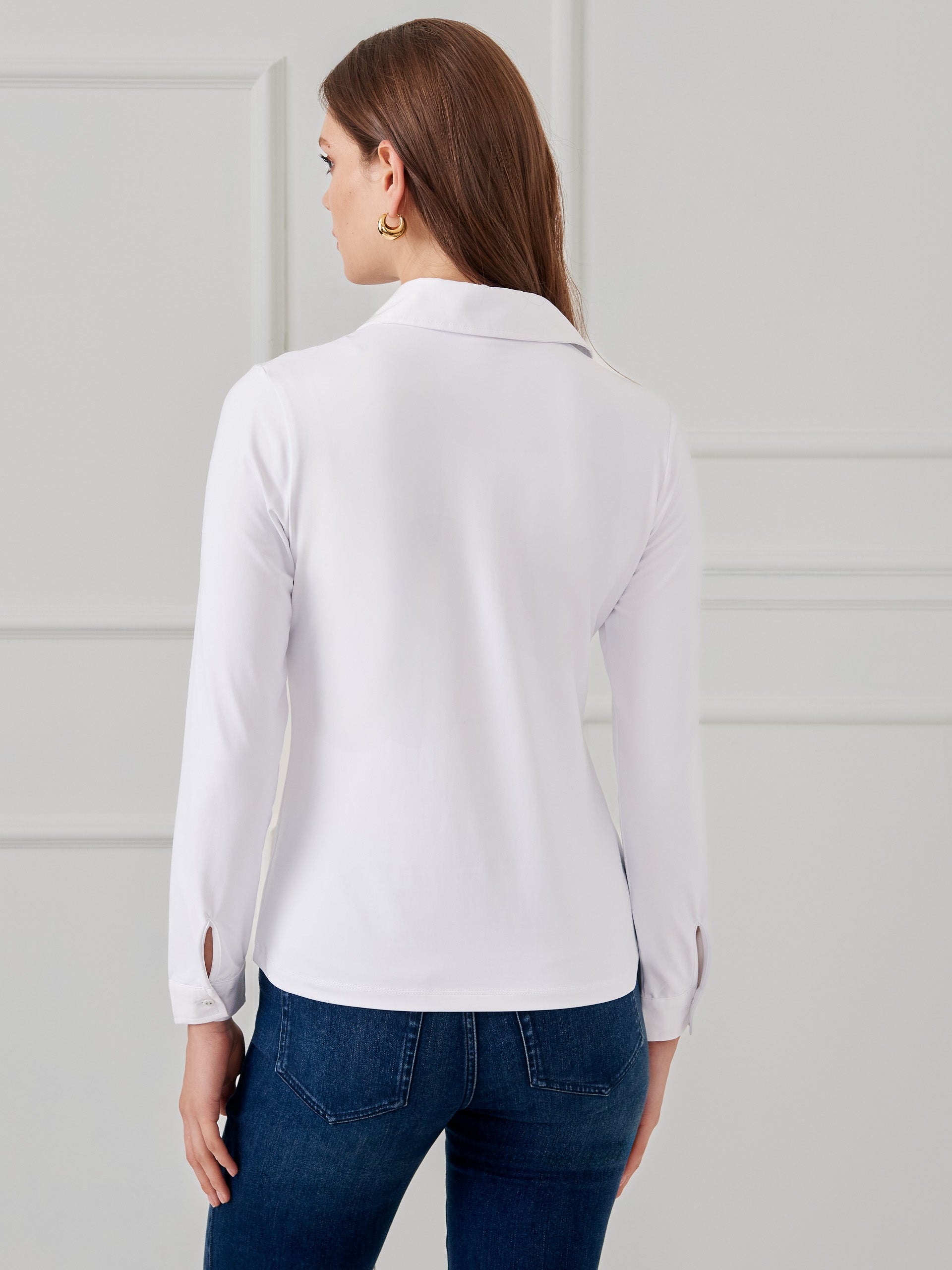 Model wearing J.McLaughlin Betty shirt in white made with Catalina cloth.