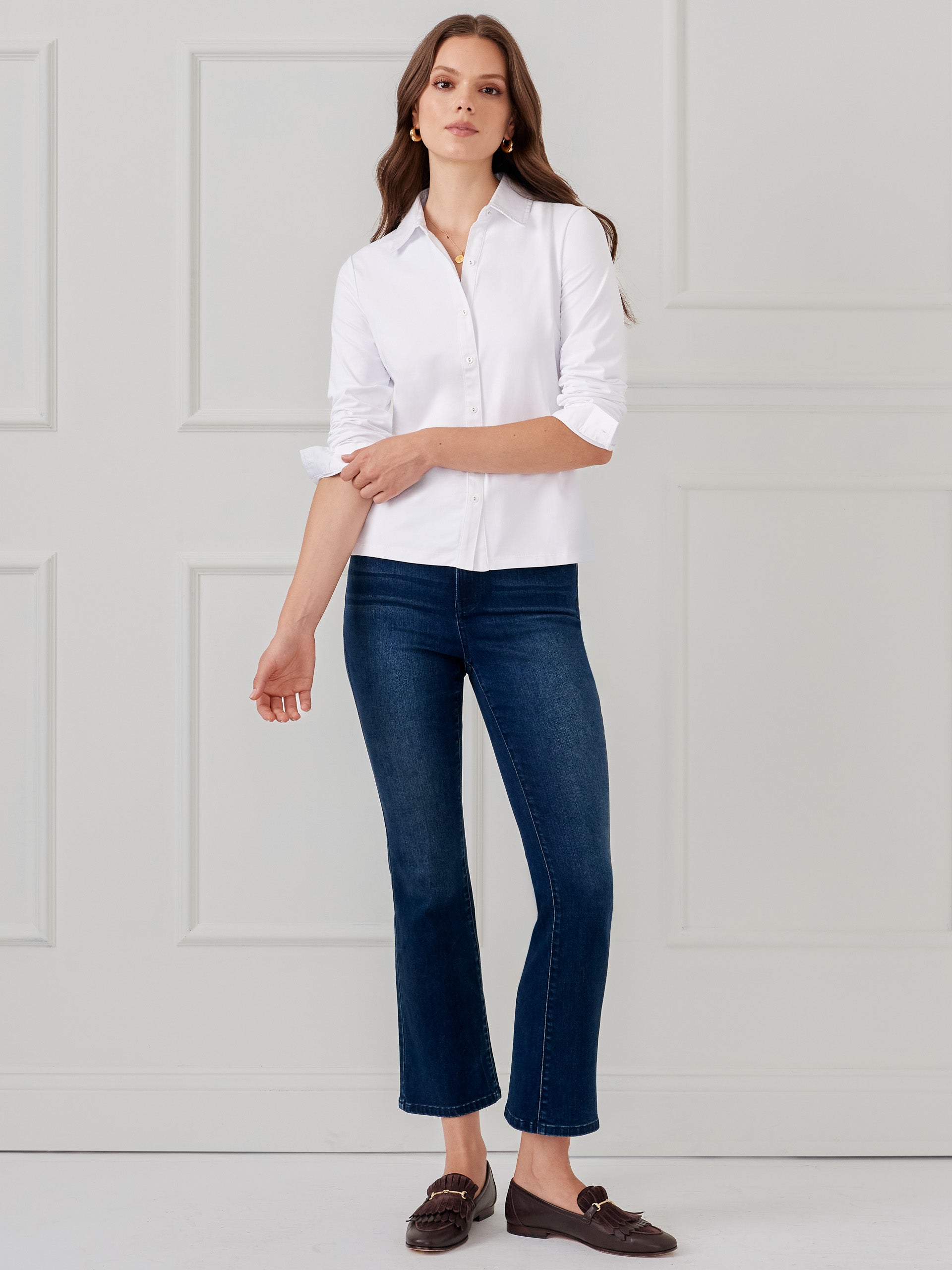 Model wearing J.McLaughlin Betty shirt in white made with Catalina cloth.