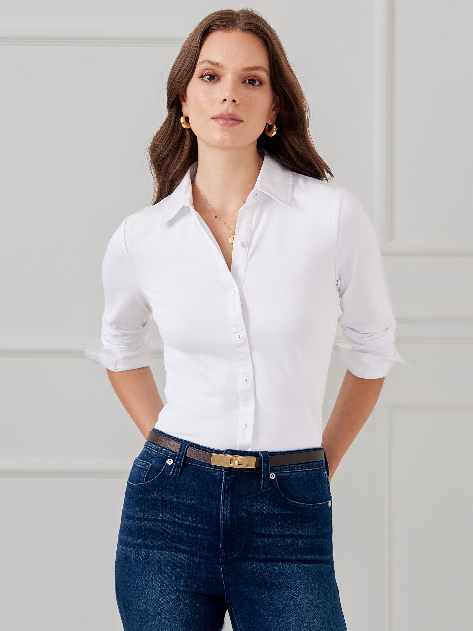 Model wearing J.McLaughlin Betty shirt in white made with Catalina cloth.