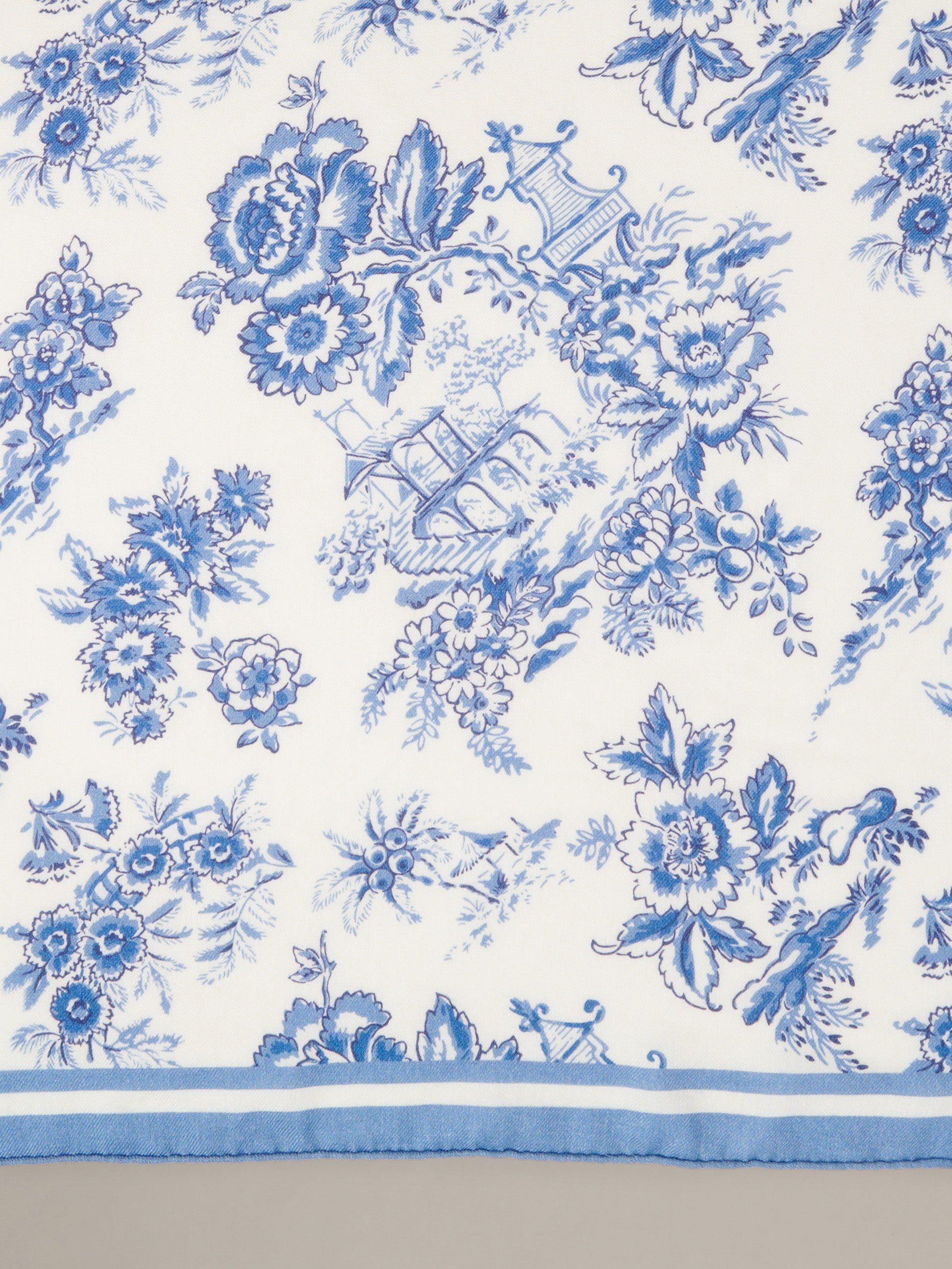 The Blair Scarf in Antique Toile Corner by J.McLaughlin featuring an elegant blue and white floral toile pattern with a classic border.