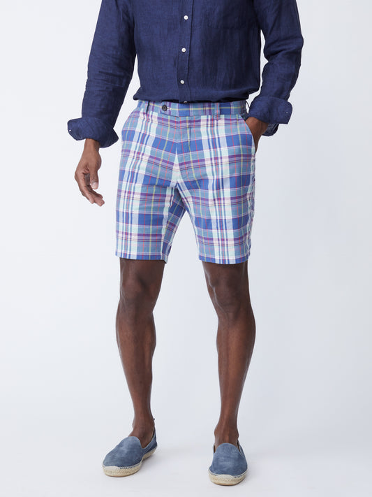 Model wearing J.McLaughlin Oliver shorts in white/blue/red made with cotton.