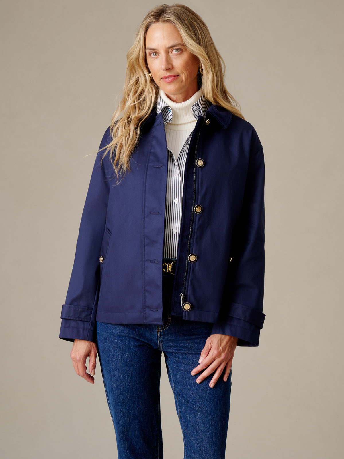 J.McLaughlin Brantley Jacket in navy styled with a striped shirt, white turtleneck, and jeans for a timeless polished look